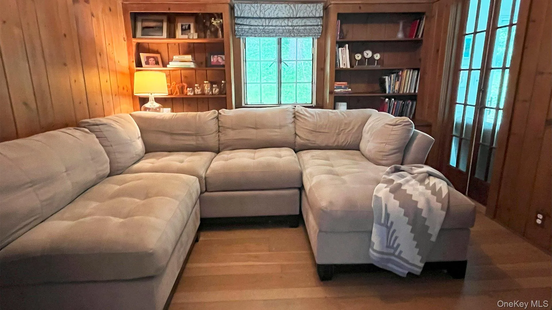 Cosy paneled TV room with hardwood floors Cosy paneled TV room with hardwood floors
