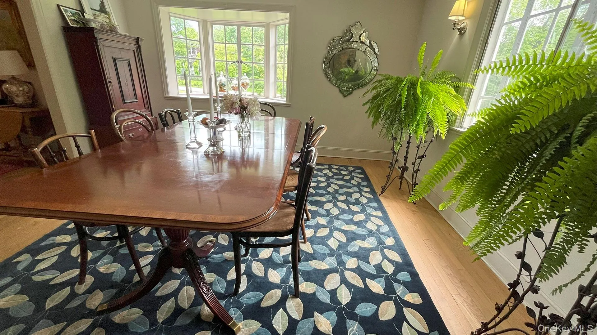 Dining room with ample natural light and gleaming hardwood floors Dining room with ample natural light and gleaming hardwood floors