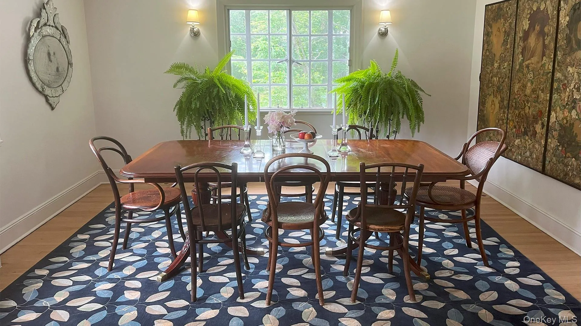 Dining room with ample natural light and gleaming hardwood floors Dining room with ample natural light and gleaming hardwood floors