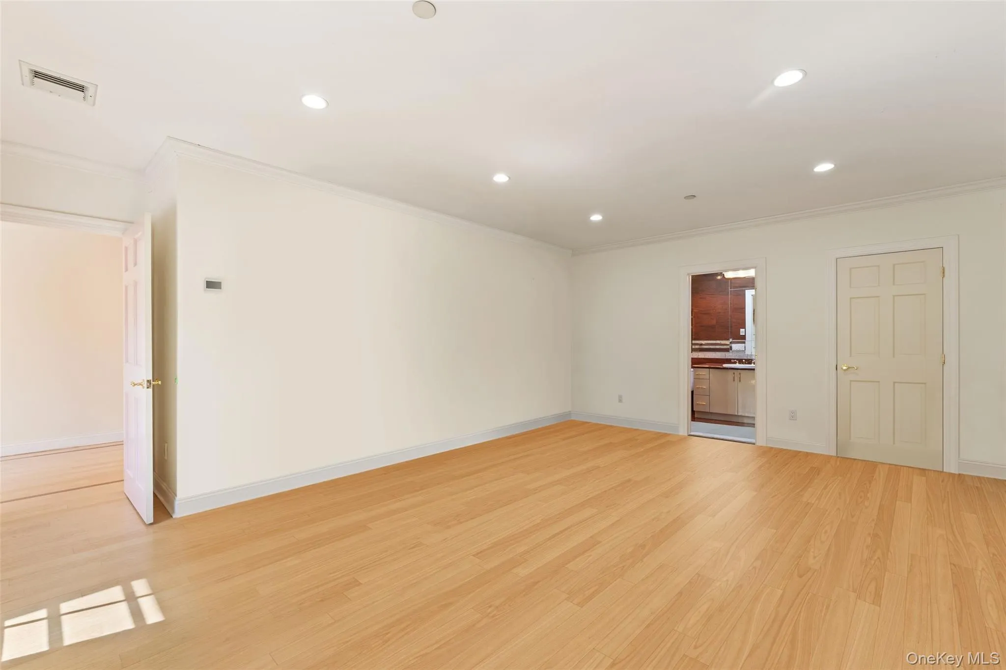2nd floor bedroom featuring recessed lighting, light wood-style flooring, and crown molding 2nd floor bedroom featuring recessed lighting, light wood-style flooring, and crown molding