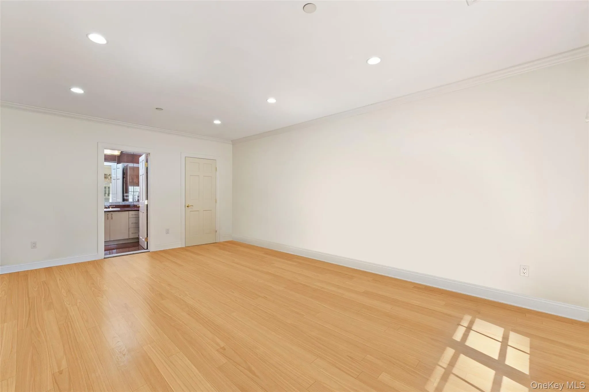 2nd floor bedroom featuring ornamental molding, recessed lighting, and light wood-style floors 2nd floor bedroom featuring ornamental molding, recessed lighting, and light wood-style floors