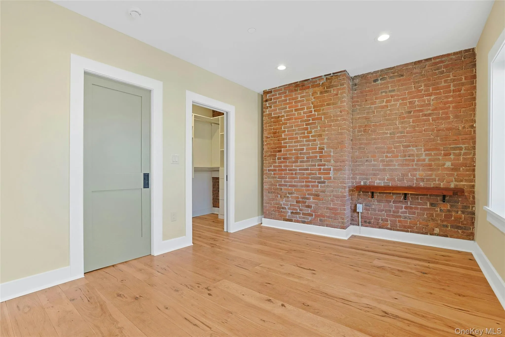 Light-filled bedroom and walk-in closet. Light-filled bedroom and walk-in closet.