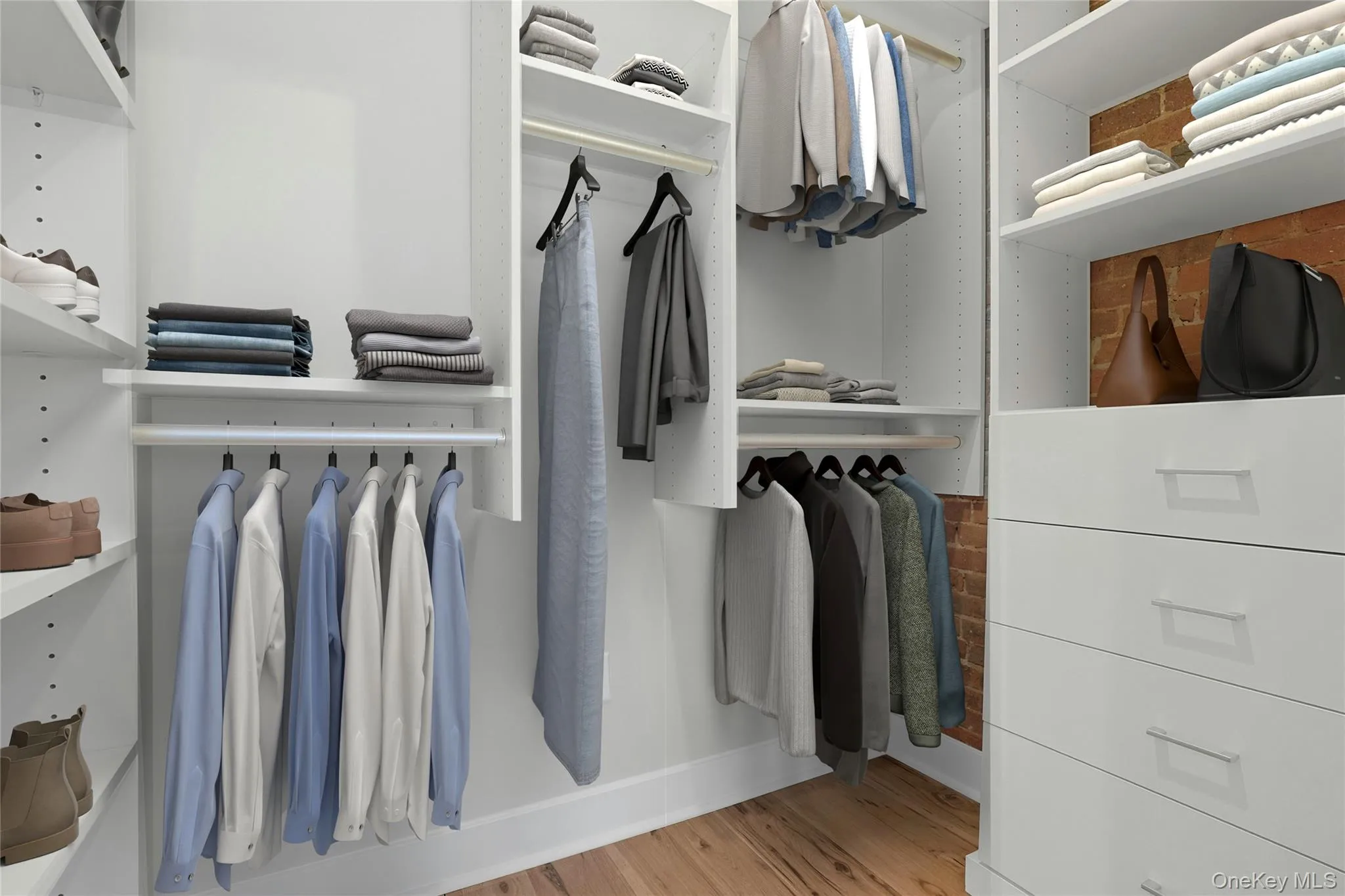 Virtually staged large walk-in closet in bedroom. Virtually staged large walk-in closet in bedroom.