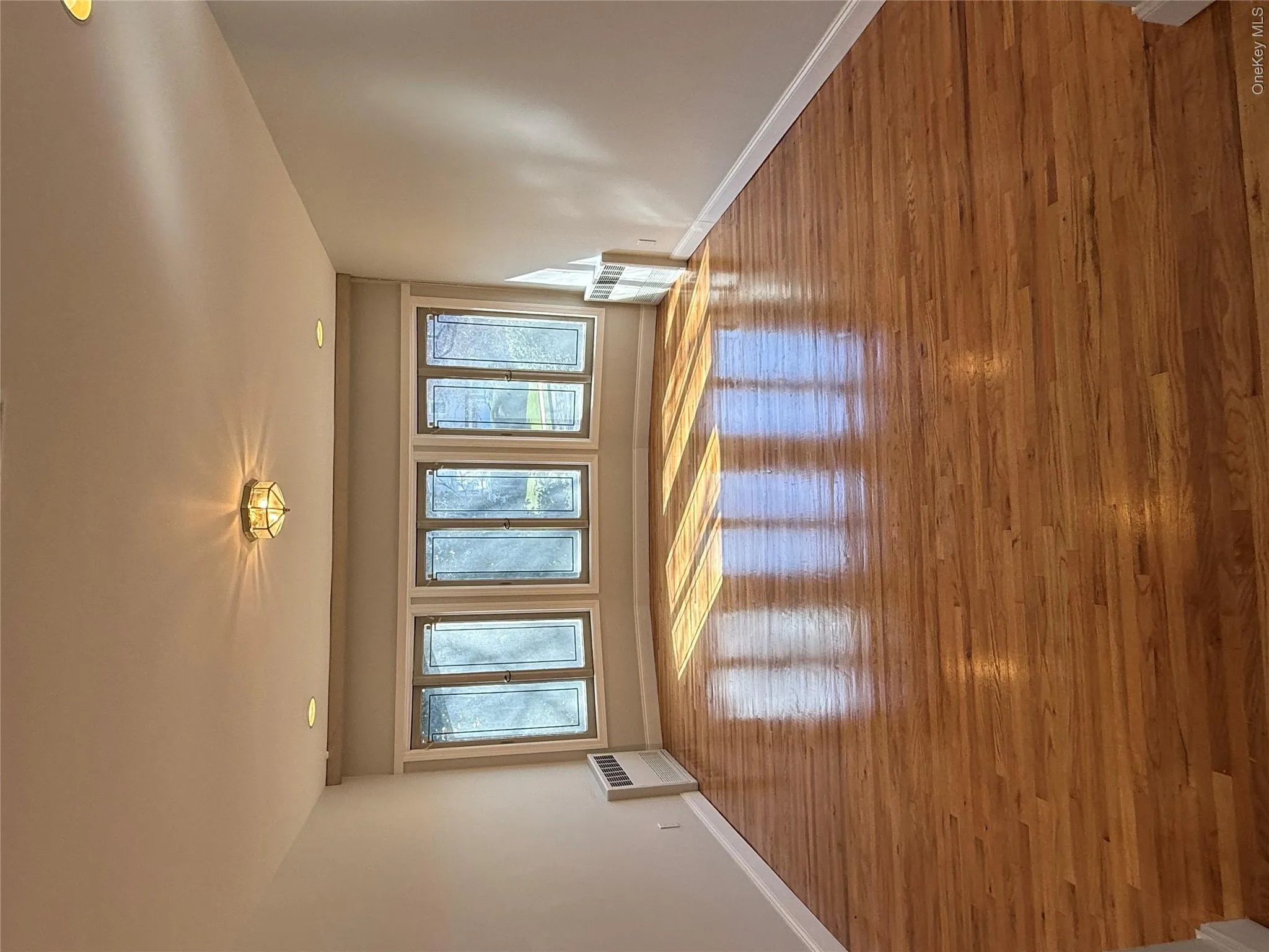 The FORMAL DINING room features hardwood floors, a bay window with multiple panes, and recessed lighting in the ceiling The FORMAL DINING room features hardwood floors, a bay window with multiple panes, and recessed lighting in the ceiling
