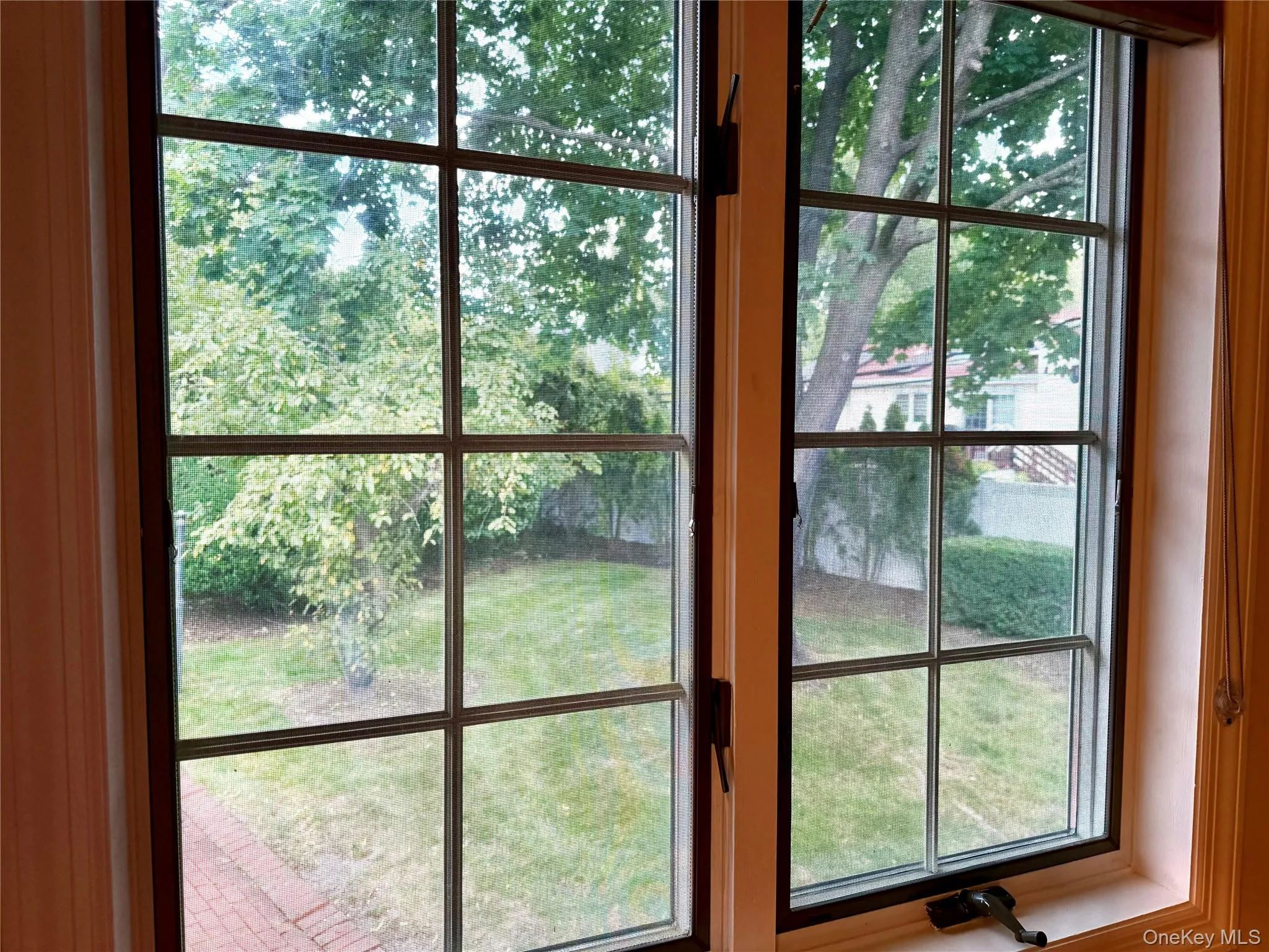 window view of backyard from primary bedroom window view of backyard from primary bedroom