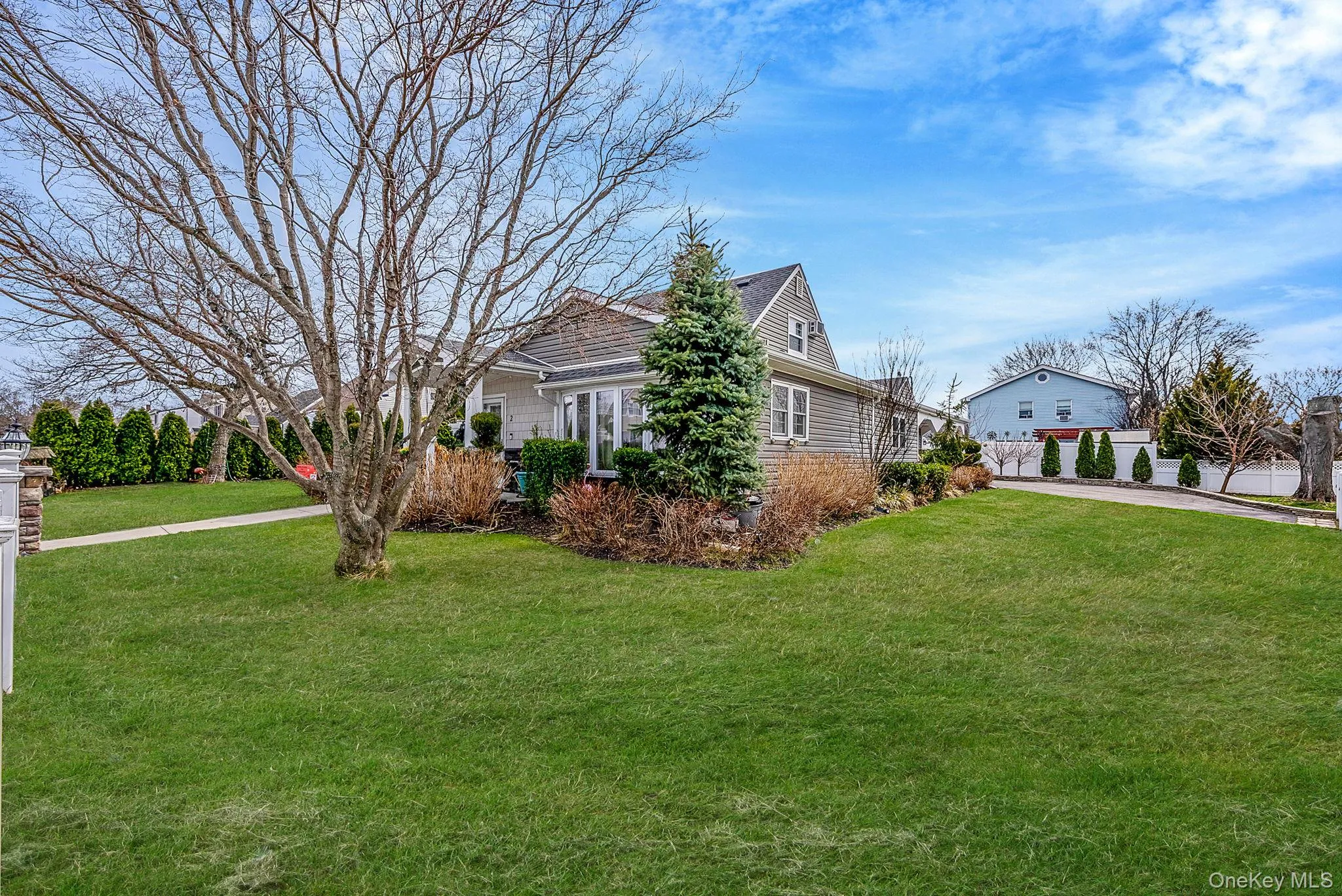 View of property exterior with a yard View of property exterior with a yard