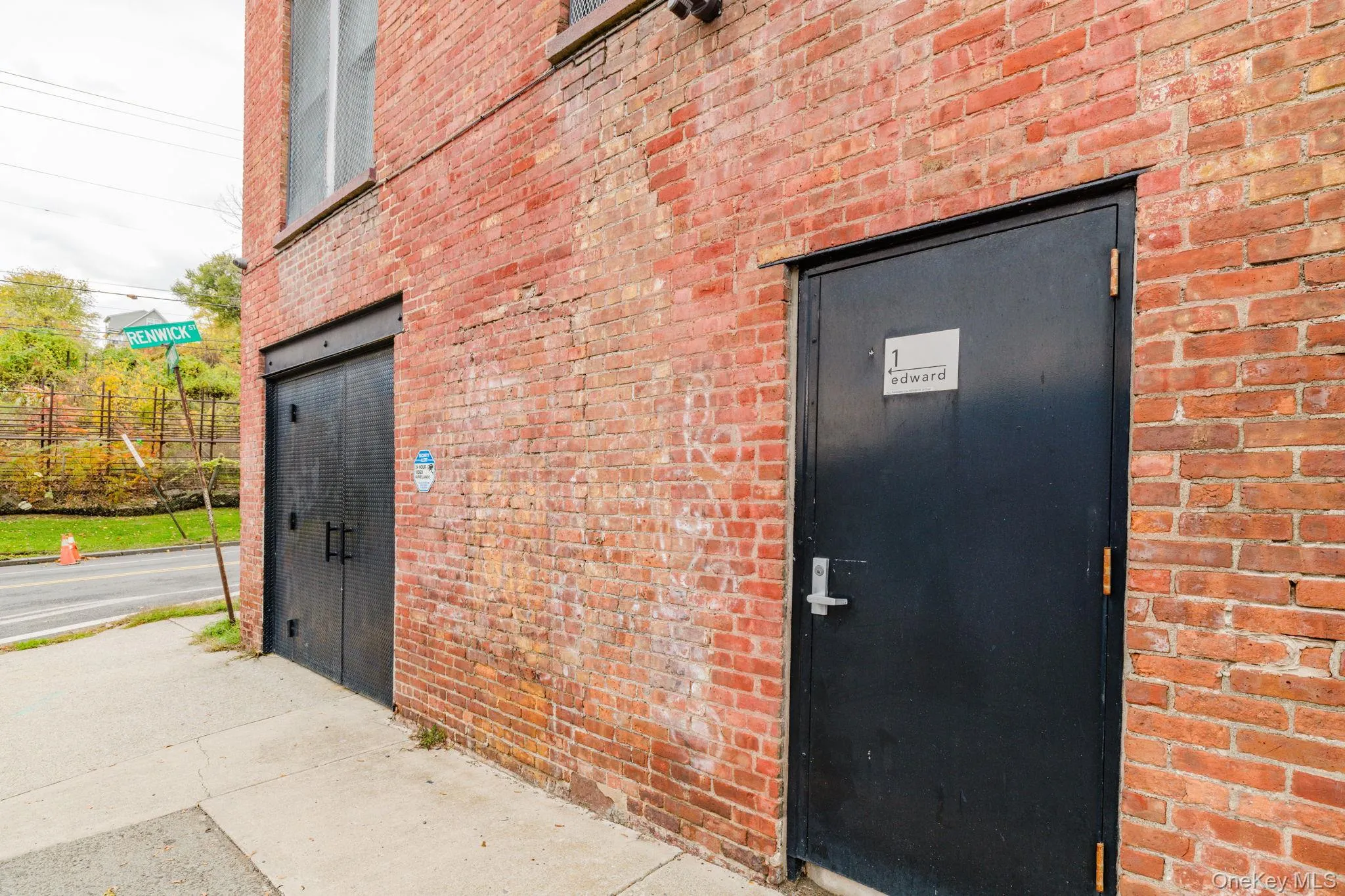 Doorway to property featuring brick siding Doorway to property featuring brick siding