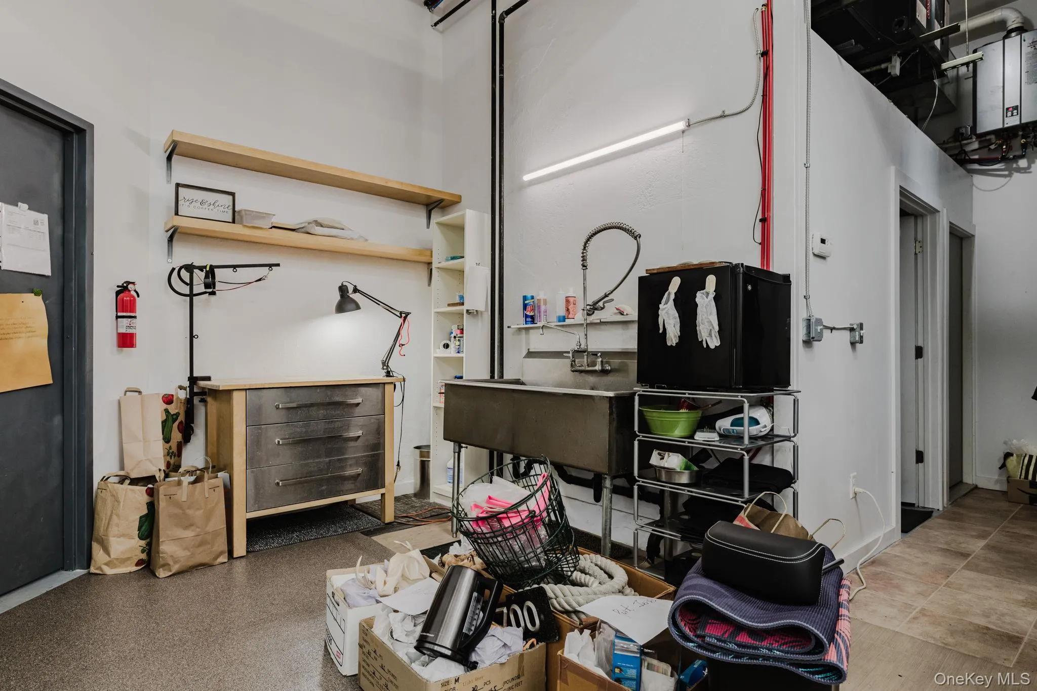 Work area with sink and hallway to bathroom Work area with sink and hallway to bathroom