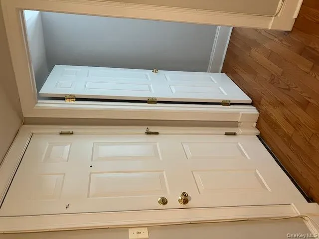 View of bedroom entry and outside door from living room View of bedroom entry and outside door from living room