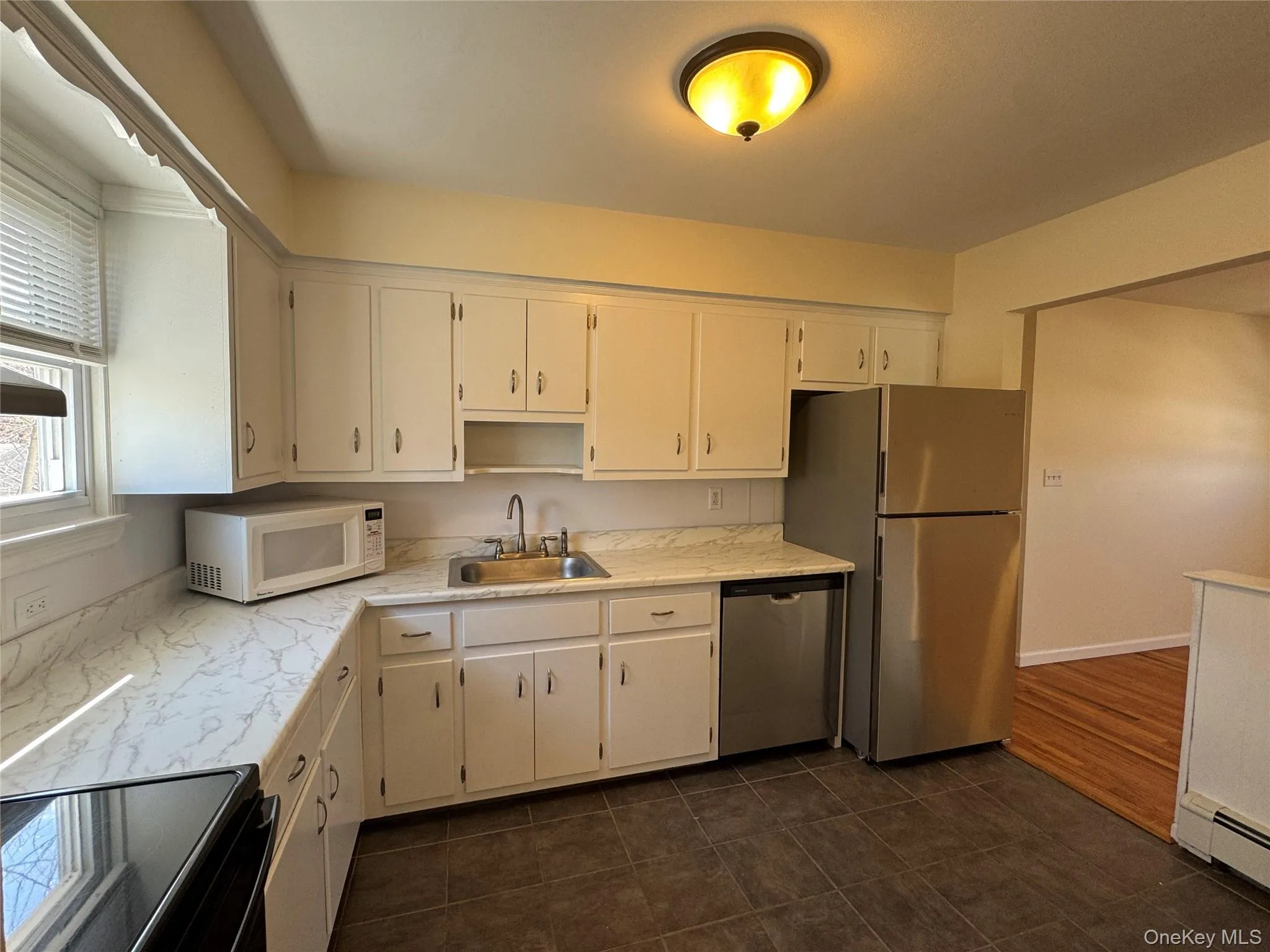 White cabinetry, stainless appliances White cabinetry, stainless appliances