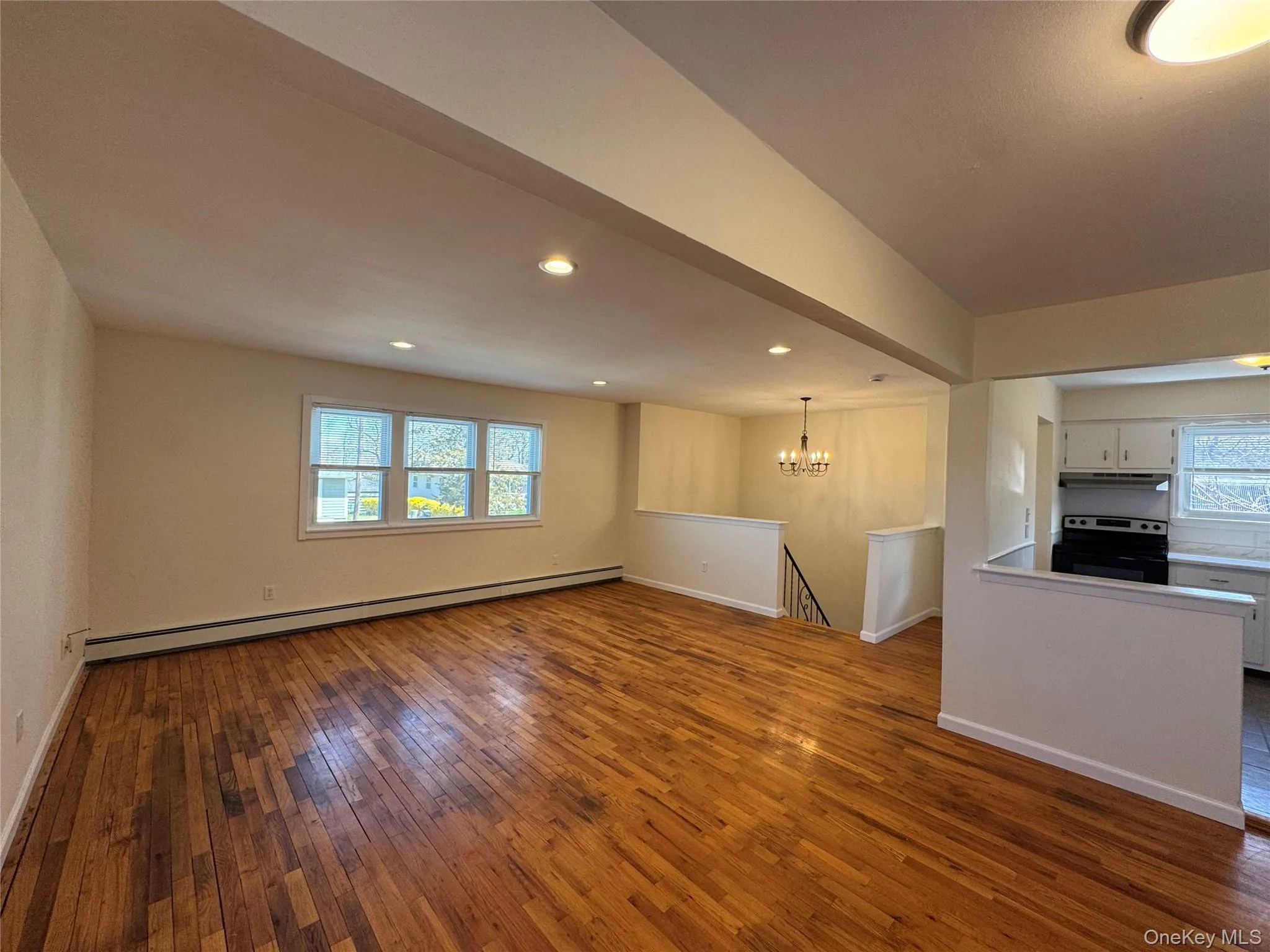Second Floor Family Room with wood floors, open to Second Floor Family Room with wood floors, open to