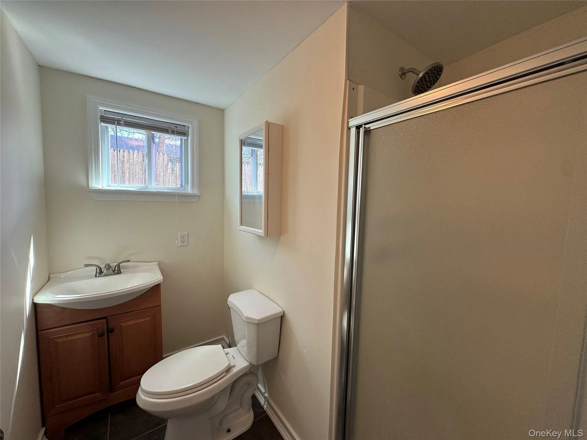 First floor - Full bath with single sink vanity and stall shower First floor - Full bath with single sink vanity and stall shower