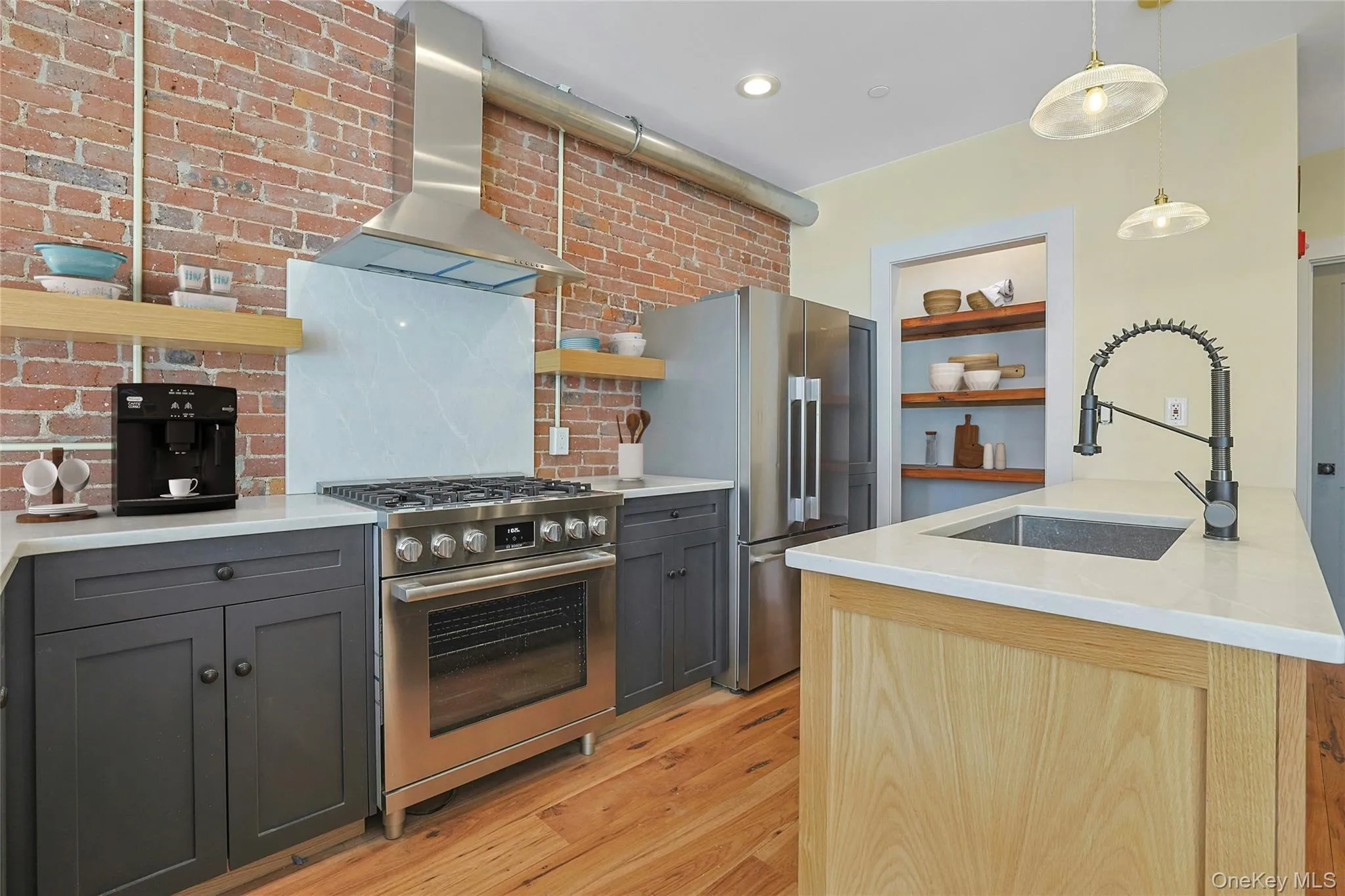 Virtually staged chef's kitchen with luxury stainless steel appliances and custom pantry. Virtually staged chef's kitchen with luxury stainless steel appliances and custom pantry.