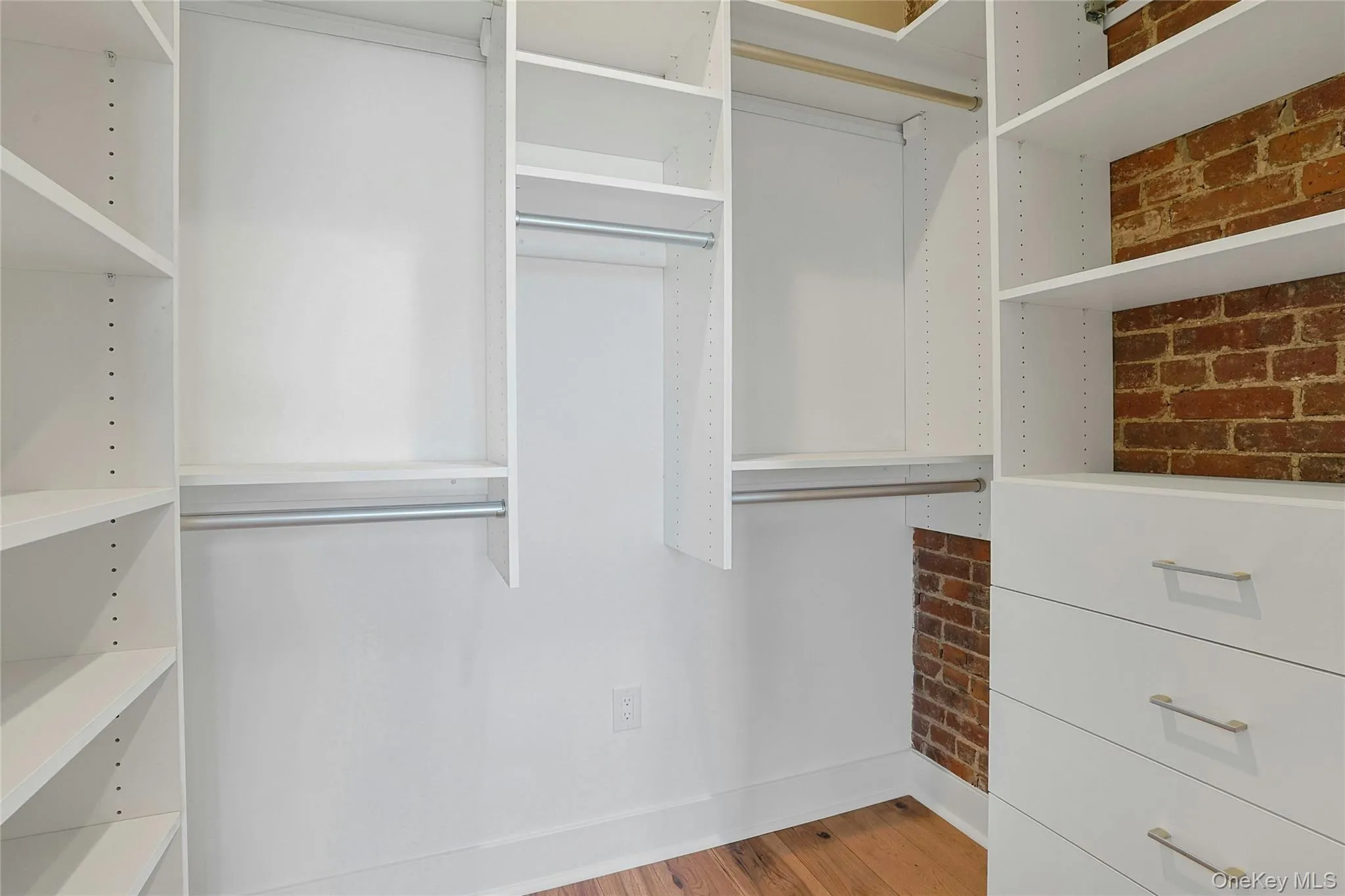 Large walk-in closet with plenty of storage space. Large walk-in closet with plenty of storage space.
