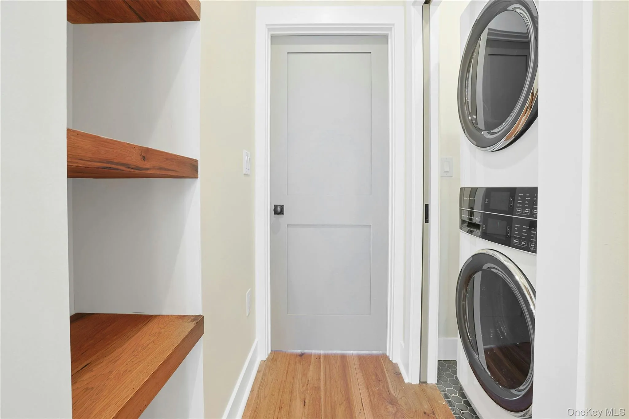 Custom shelves in hallway as you walk bedroom. In-unit laundry features new washer and dryer inside closet with pocket doors. Custom shelves in hallway as you walk bedroom. In-unit laundry features new washer and dryer inside closet with pocket doors.