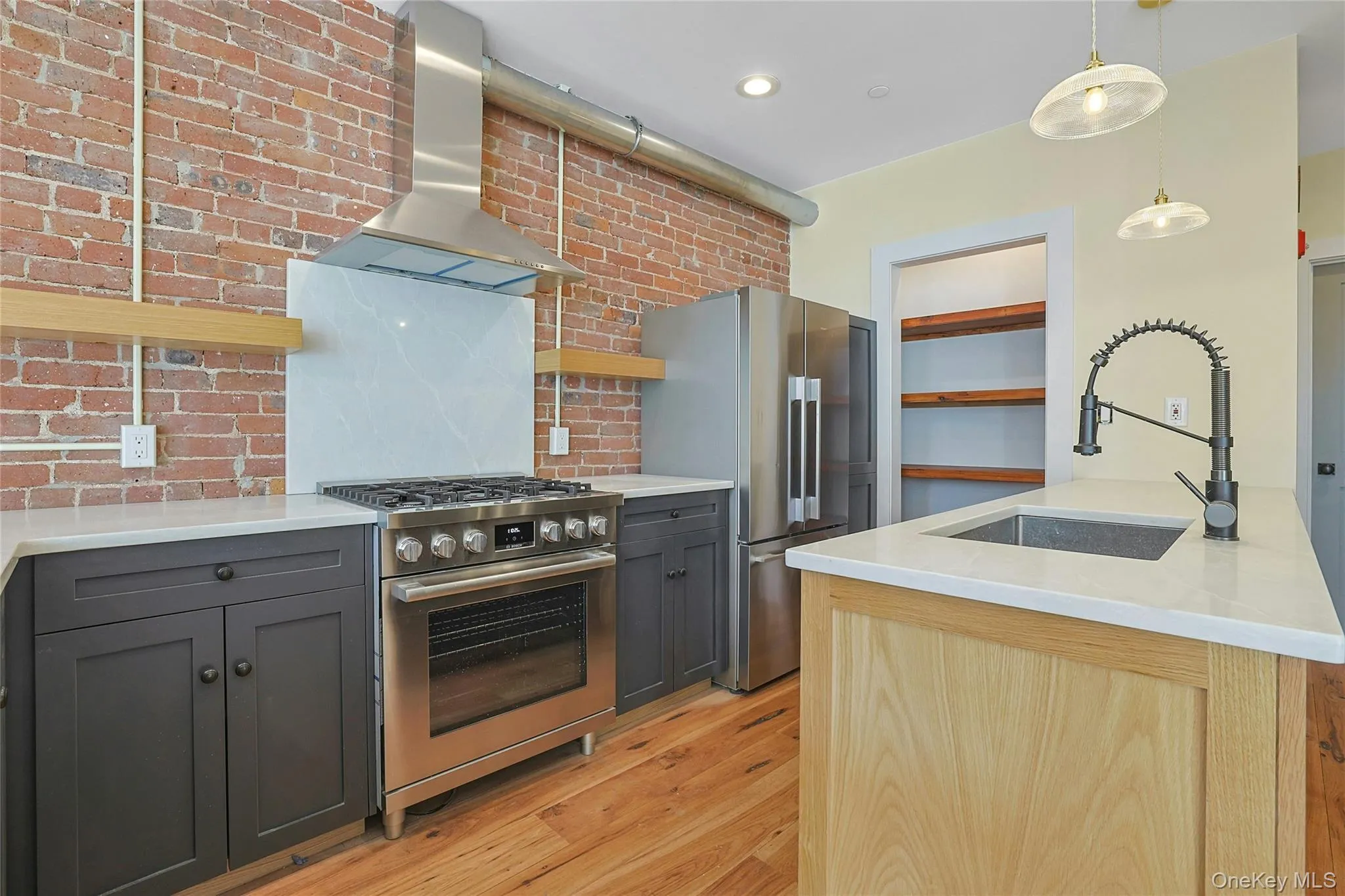 Chef's kitchen with luxury stainless steel appliances and custom pantry. Chef's kitchen with luxury stainless steel appliances and custom pantry.