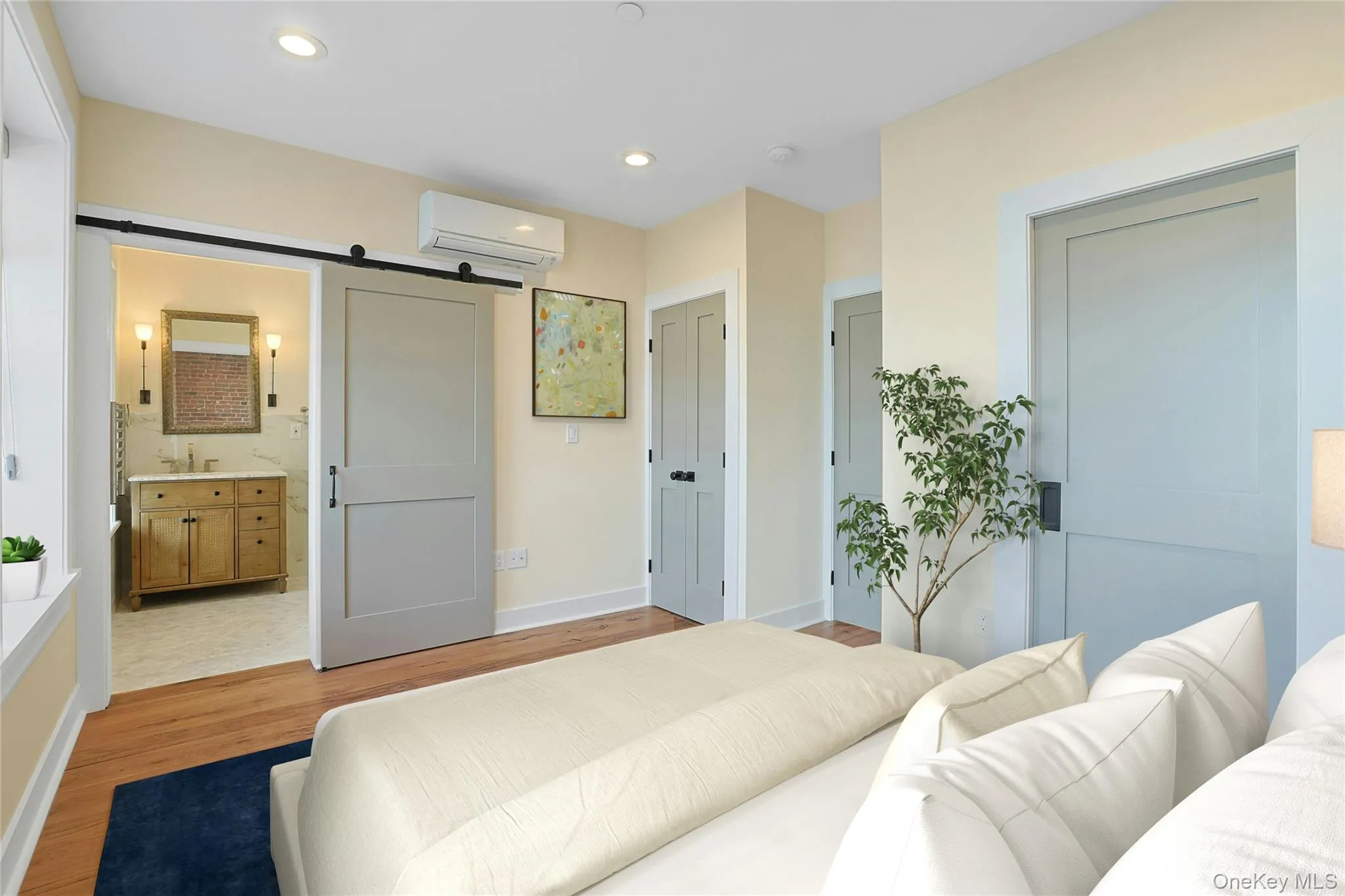 Virtually staged light-filled bedroom with en-suite bathroom and walk in closet. Virtually staged light-filled bedroom with en-suite bathroom and walk in closet.