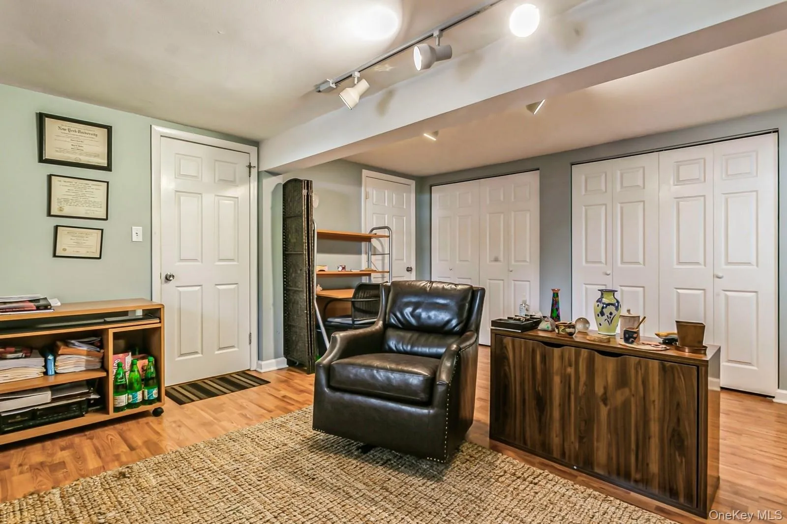 Family room with light wood-style flooring and baseboards Family room with light wood-style flooring and baseboards