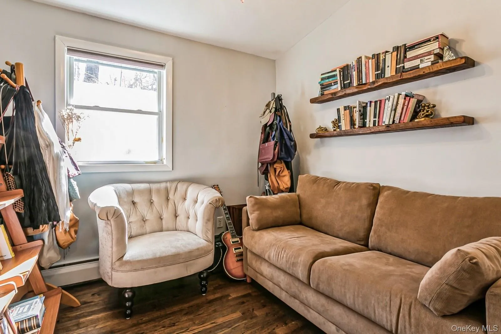 Office with dark wood-style floors and a baseboard radiator Office with dark wood-style floors and a baseboard radiator
