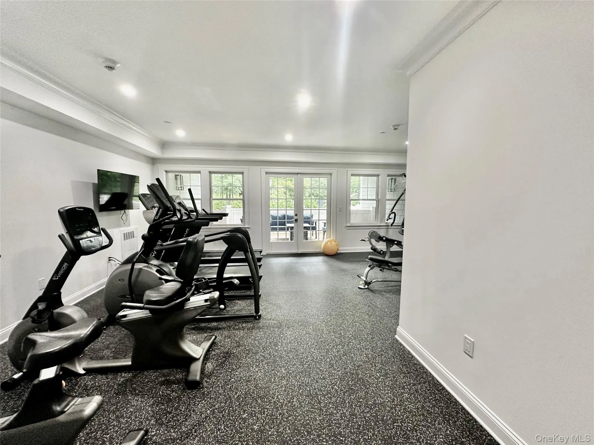 Workout area featuring french doors, recessed lighting, and ornamental molding Workout area featuring french doors, recessed lighting, and ornamental molding