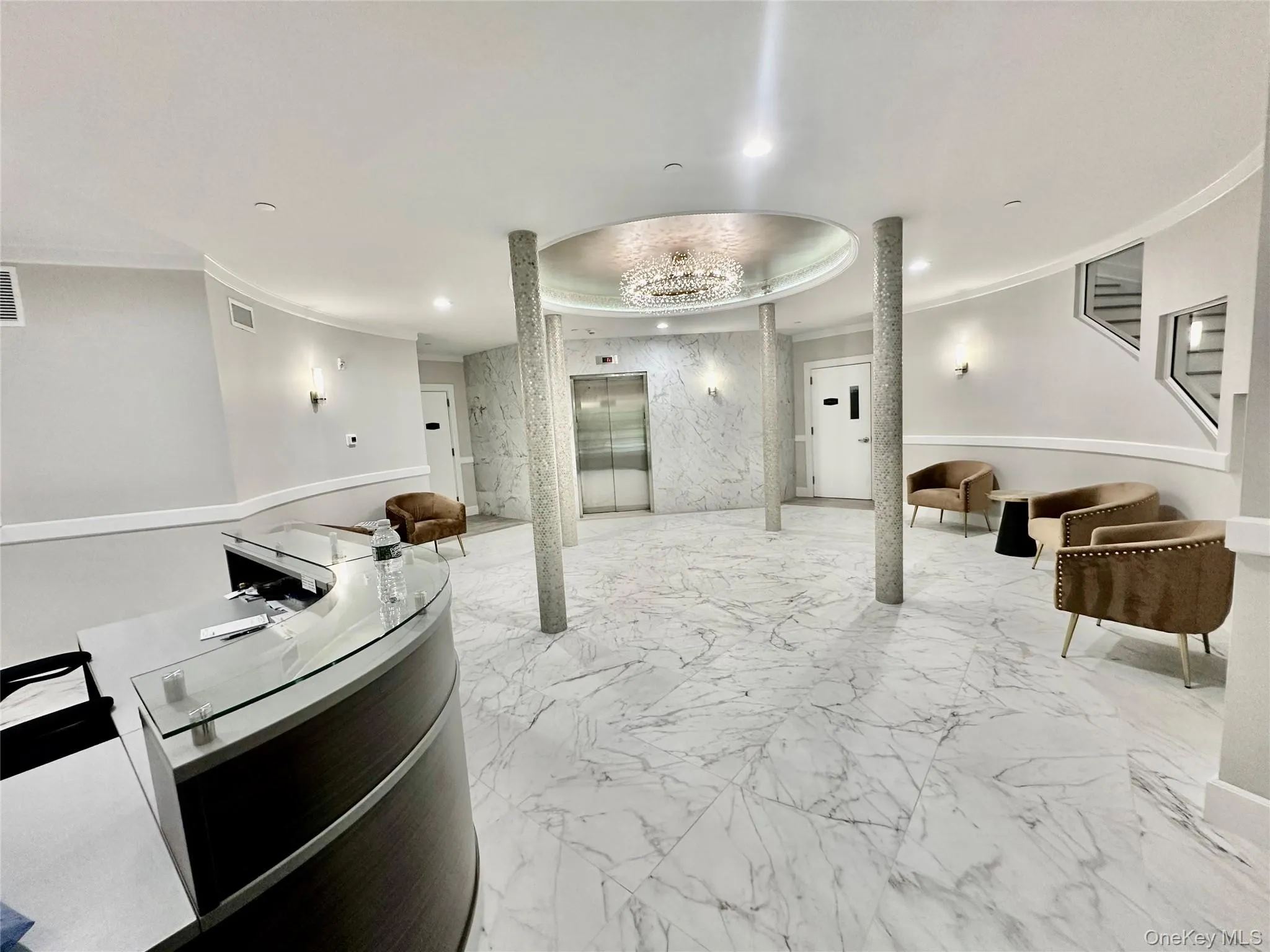 A BEAUTIFULLY APPOINTED LOBBY WITH ELEVATOR AND ENTRANCE TO GARAGE A BEAUTIFULLY APPOINTED LOBBY WITH ELEVATOR AND ENTRANCE TO GARAGE