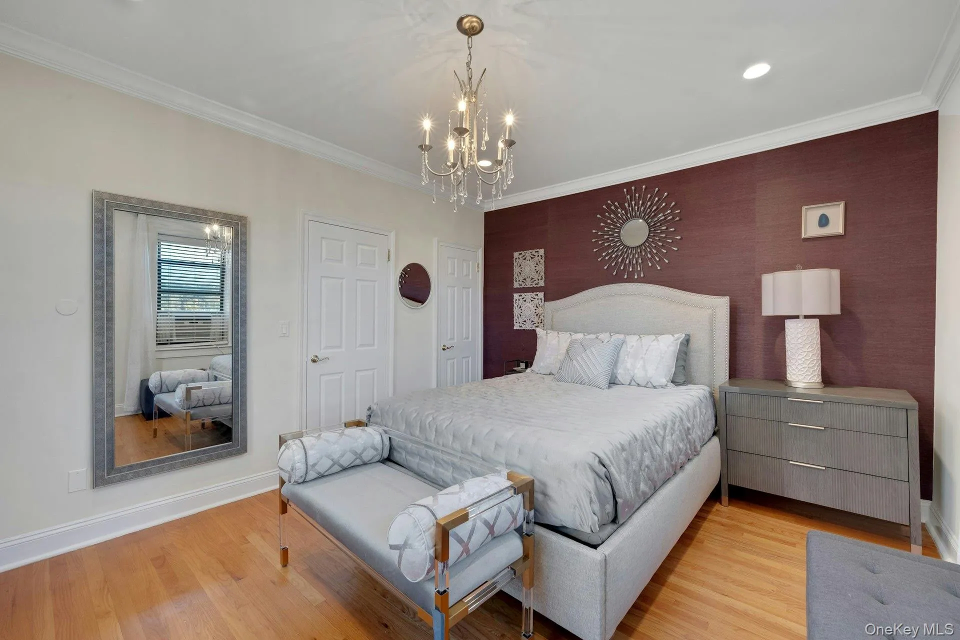 Bedroom featuring crown molding, wood finished floors, a chandelier, and recessed lighting Bedroom featuring crown molding, wood finished floors, a chandelier, and recessed lighting