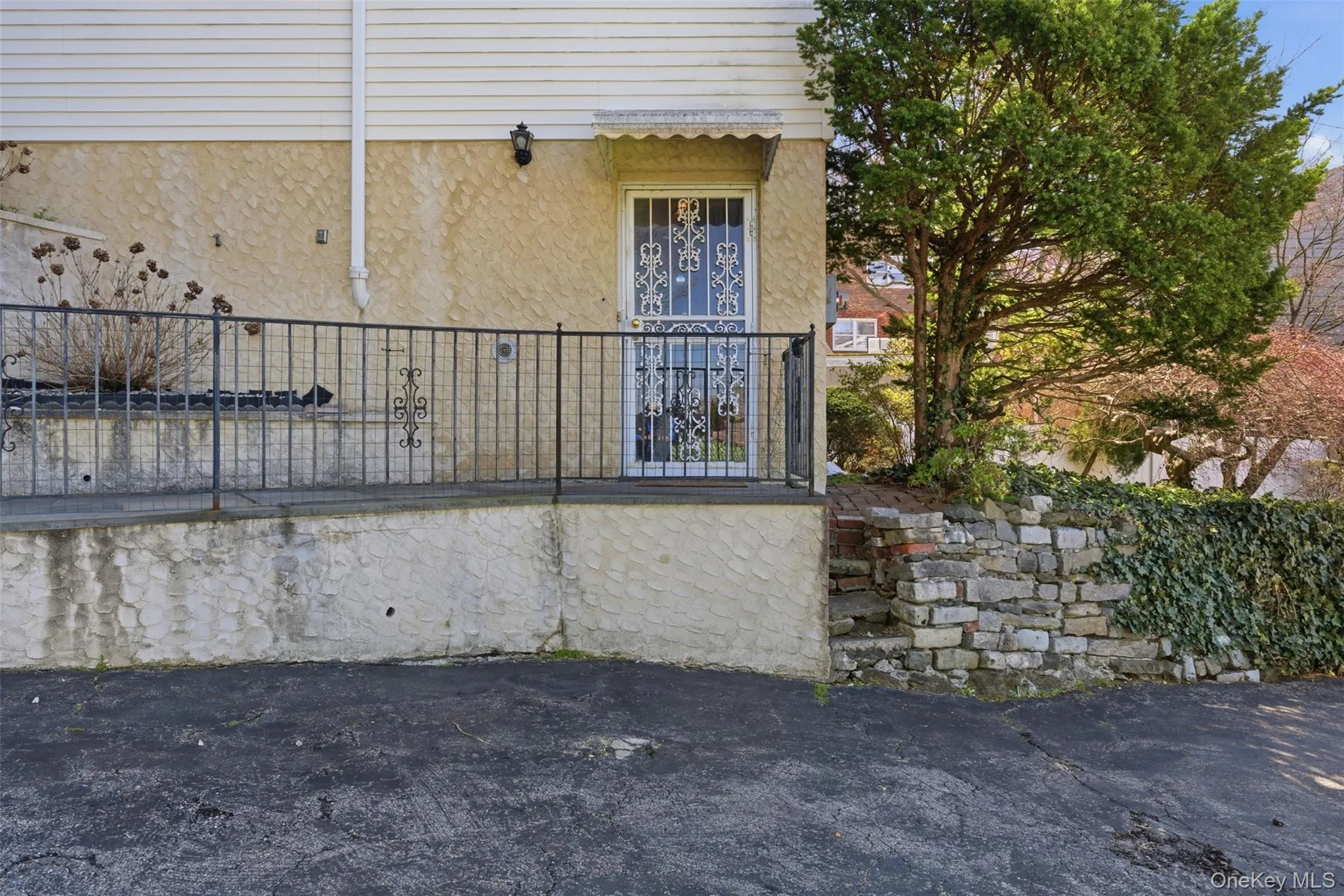 Alternate view of the front of the property with private entrance and parking. Alternate view of the front of the property with private entrance and parking.