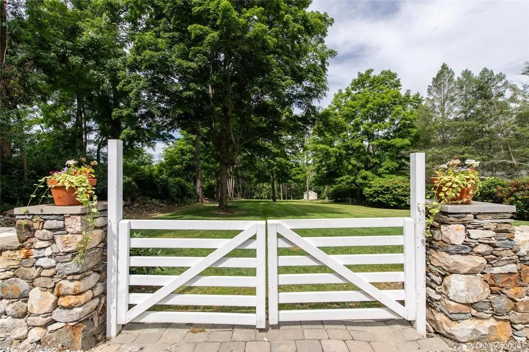 View of gate with a yard View of gate with a yard