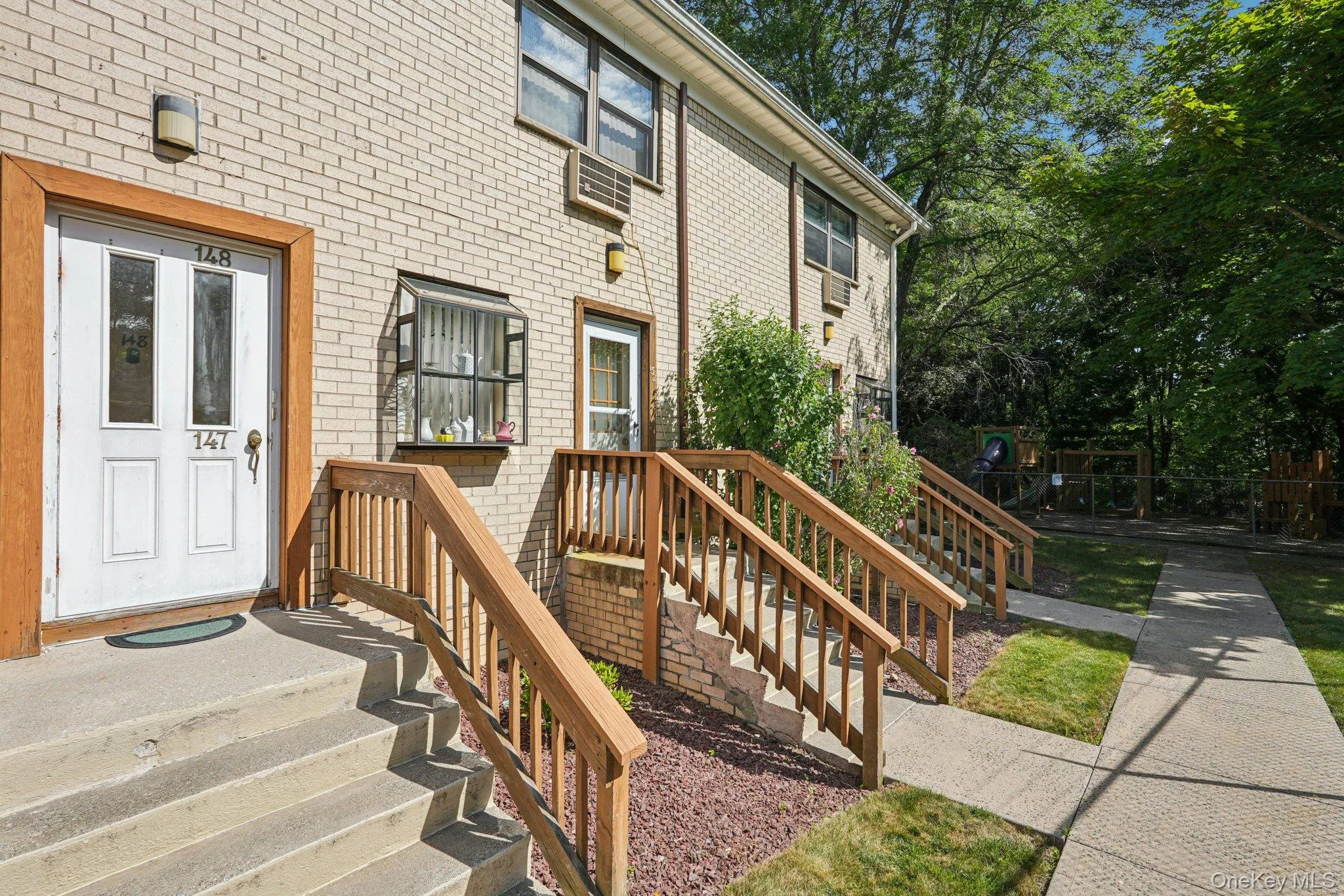 Property entrance featuring brick siding Property entrance featuring brick siding