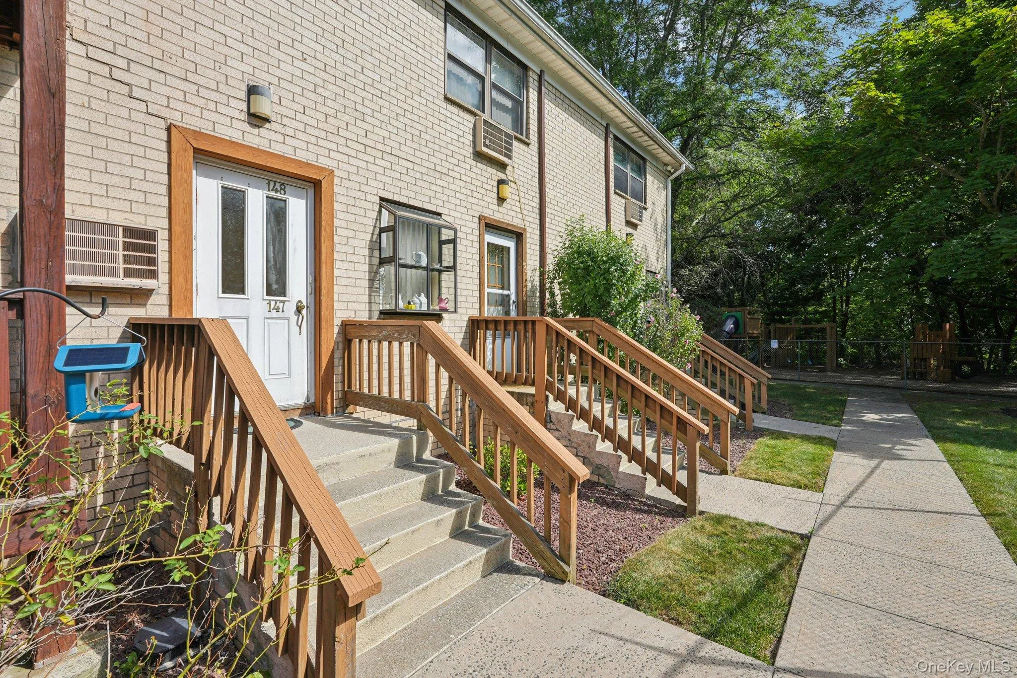 Doorway to property featuring brick siding Doorway to property featuring brick siding