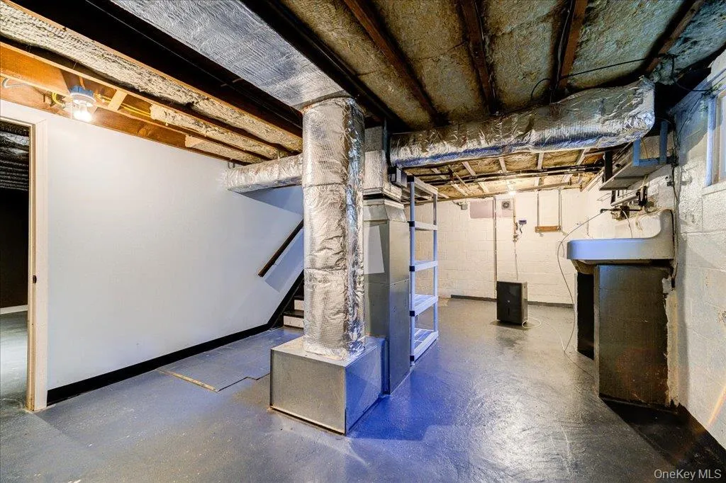 Basement featuring heating unit Basement featuring heating unit