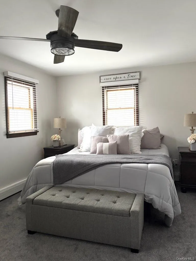 Bedroom featuring carpet floors and ceiling fan Bedroom featuring carpet floors and ceiling fan