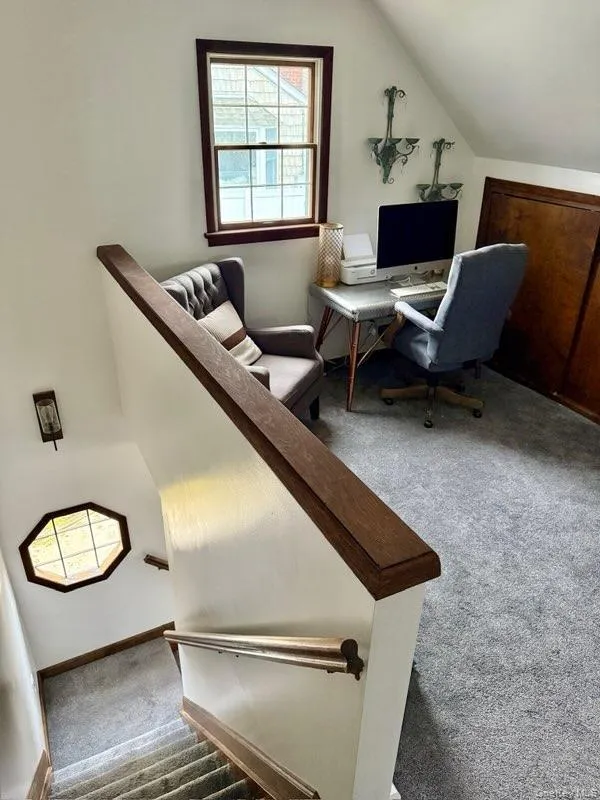 Carpeted office featuring vaulted ceiling Carpeted office featuring vaulted ceiling