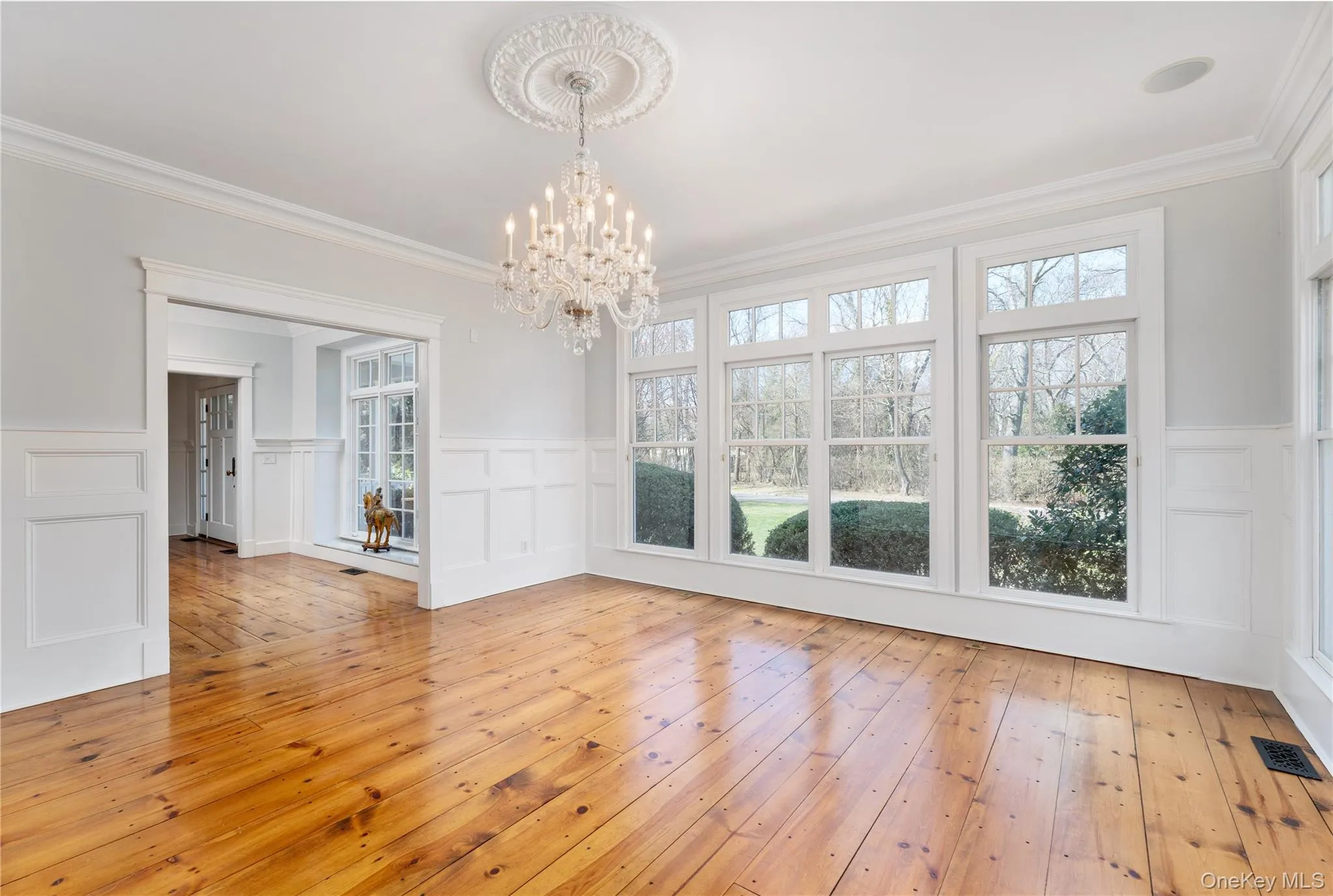 Formal Dining Room With Walls Of Windows & Custom Millwork Throughout. Formal Dining Room With Walls Of Windows & Custom Millwork Throughout.