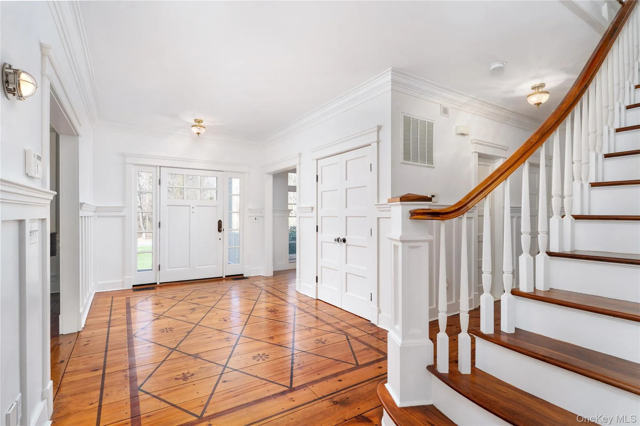 Welcoming Entry Foyer With Gleaming Hardwood Floors. Welcoming Entry Foyer With Gleaming Hardwood Floors.