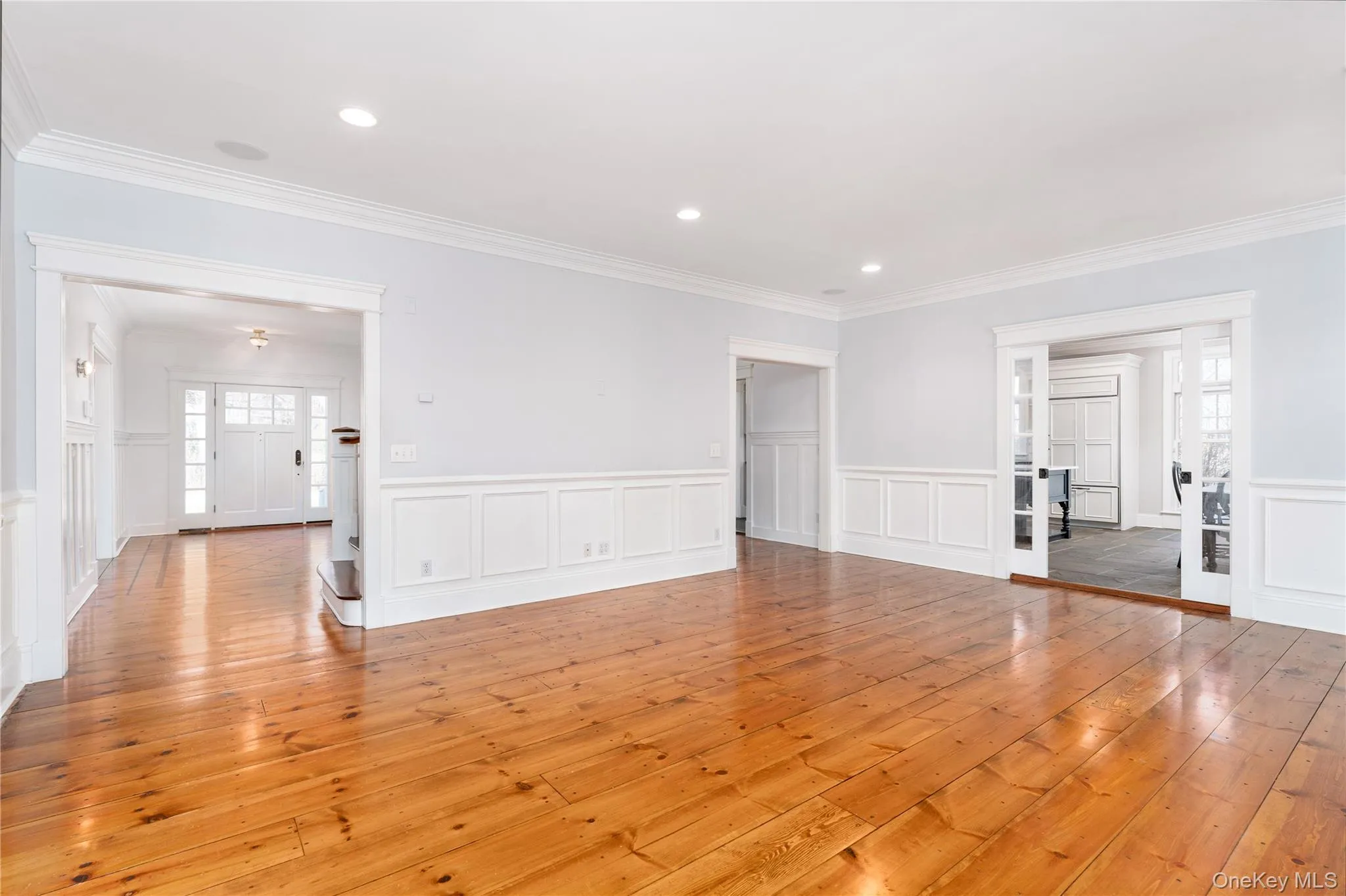 Generously Proportioned Den With Wood Burning Fireplace With Pocket Doors To Kitchen and French Doors To Sunroom and Enclosed Porch. Generously Proportioned Den With Wood Burning Fireplace With Pocket Doors To Kitchen and French Doors To Sunroom and Enclosed Porch.