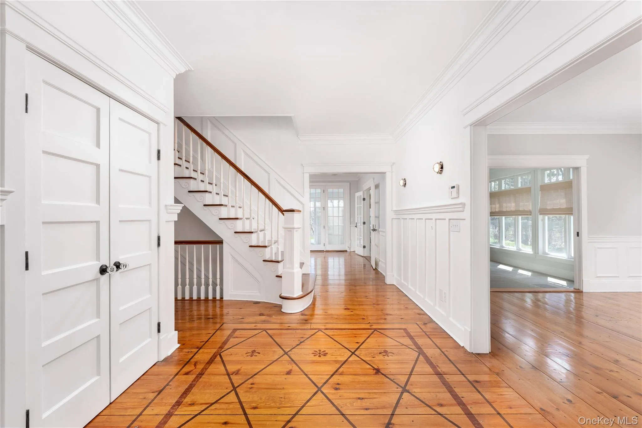 Welcoming Entry Foyer With Custom Staircase & Attention to Detail Throughout. Welcoming Entry Foyer With Custom Staircase & Attention to Detail Throughout.