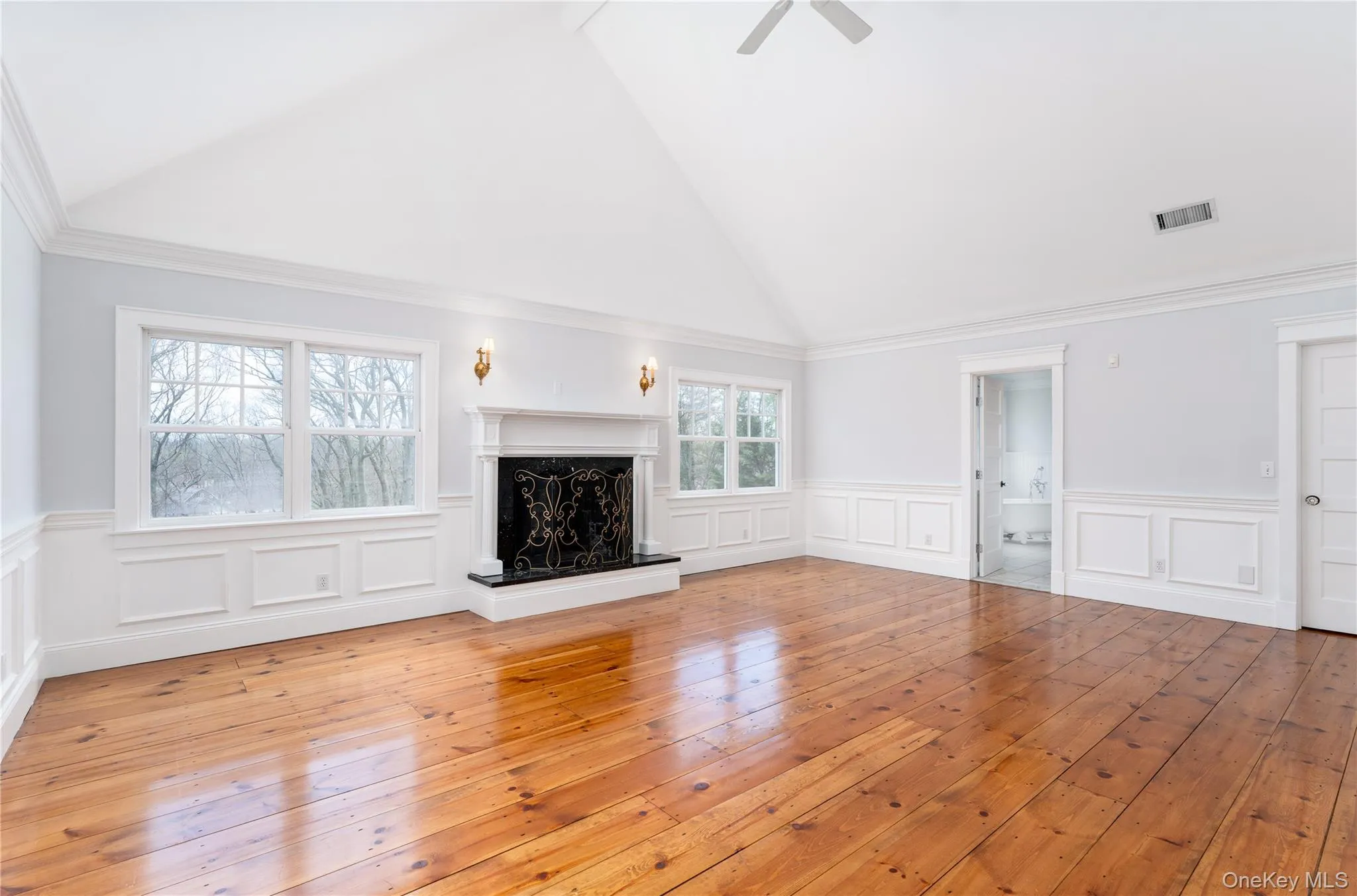 Luxurious Primary Bedroom Suite With Vaulted Ceiling, Fireplace & Windows Overlooking Yard & Pond, His & Hers Walk-In Closets & Marble En-Suite Bathroom Luxurious Primary Bedroom Suite With Vaulted Ceiling, Fireplace & Windows Overlooking Yard & Pond, His & Hers Walk-In Closets & Marble En-Suite Bathroom