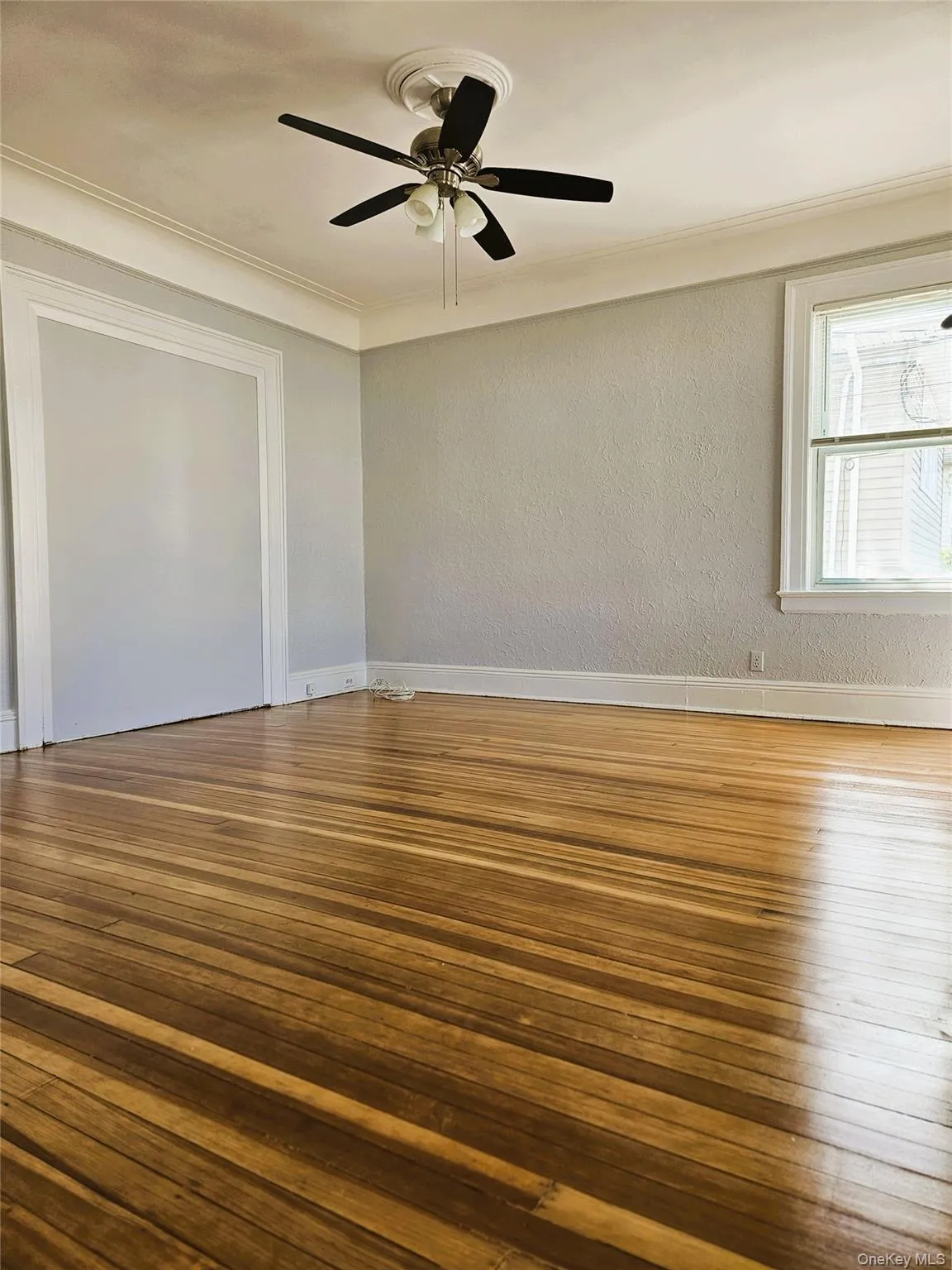 large living room with hardwood flooring and ceiling fan large living room with hardwood flooring and ceiling fan