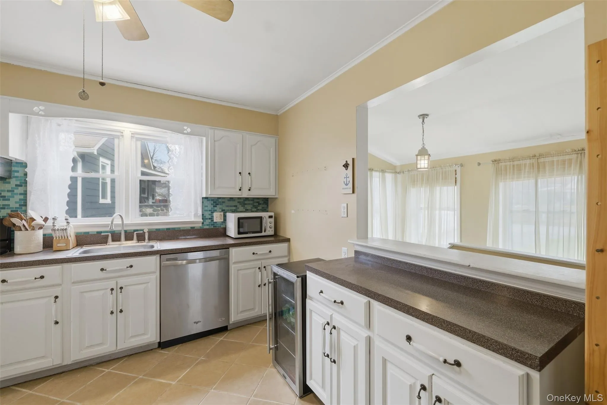The kitchen cutout brings lots of light in and opens the space up nicely The kitchen cutout brings lots of light in and opens the space up nicely