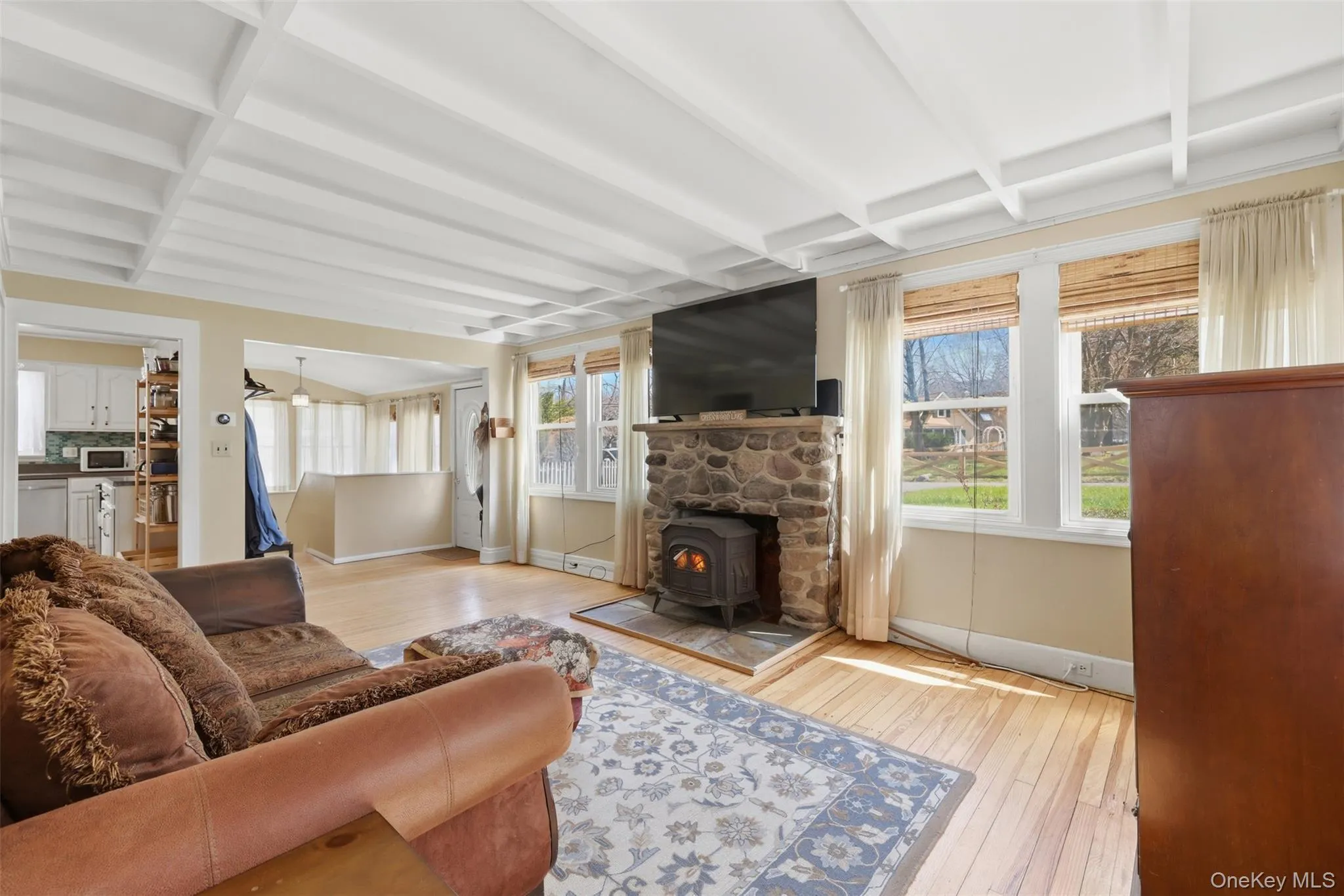 Beautiful detail and charm, hardwood floors, wood burning stove, ceiling detail, and lots of natural light with big windows Beautiful detail and charm, hardwood floors, wood burning stove, ceiling detail, and lots of natural light with big windows