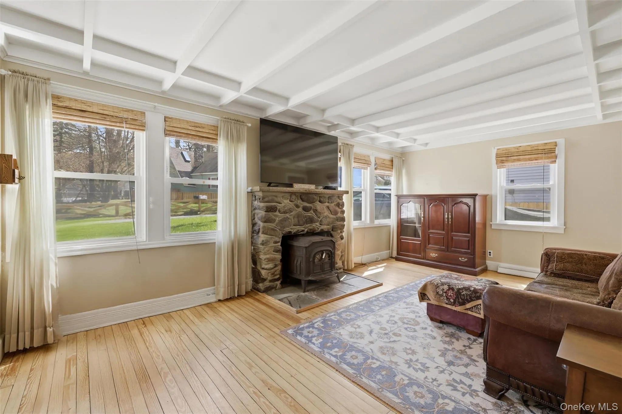Beautiful detail and charm, hardwood floors, wood burning stove, ceiling detail, and lots of natural light with big windows Beautiful detail and charm, hardwood floors, wood burning stove, ceiling detail, and lots of natural light with big windows