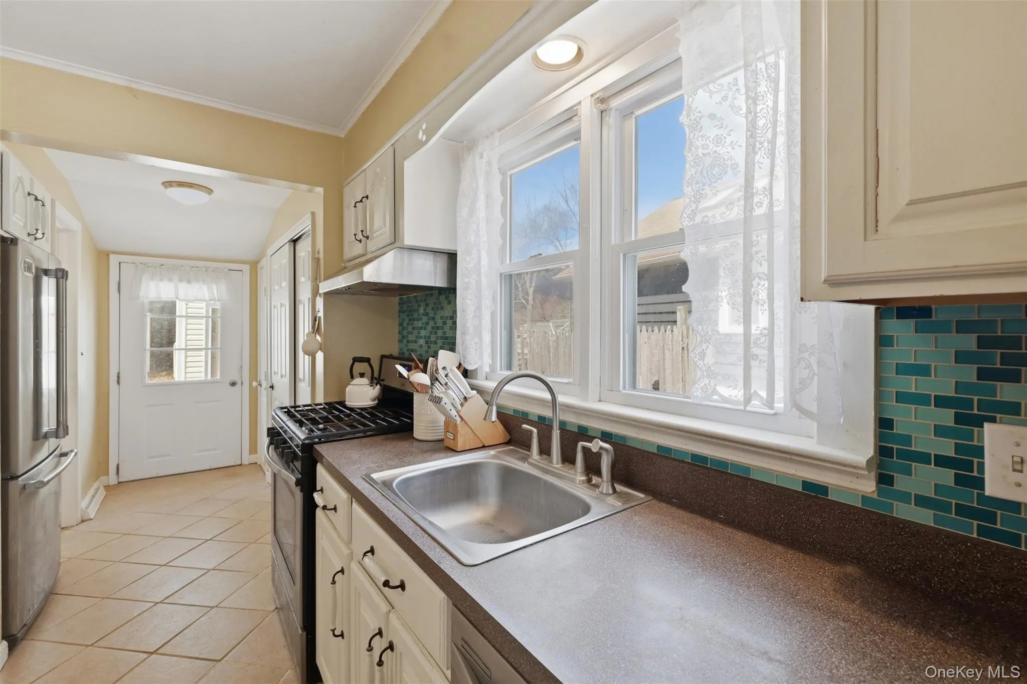 Access to the backyard off the kitchen makes entertaining or grilling meals a delight. Access to the backyard off the kitchen makes entertaining or grilling meals a delight.