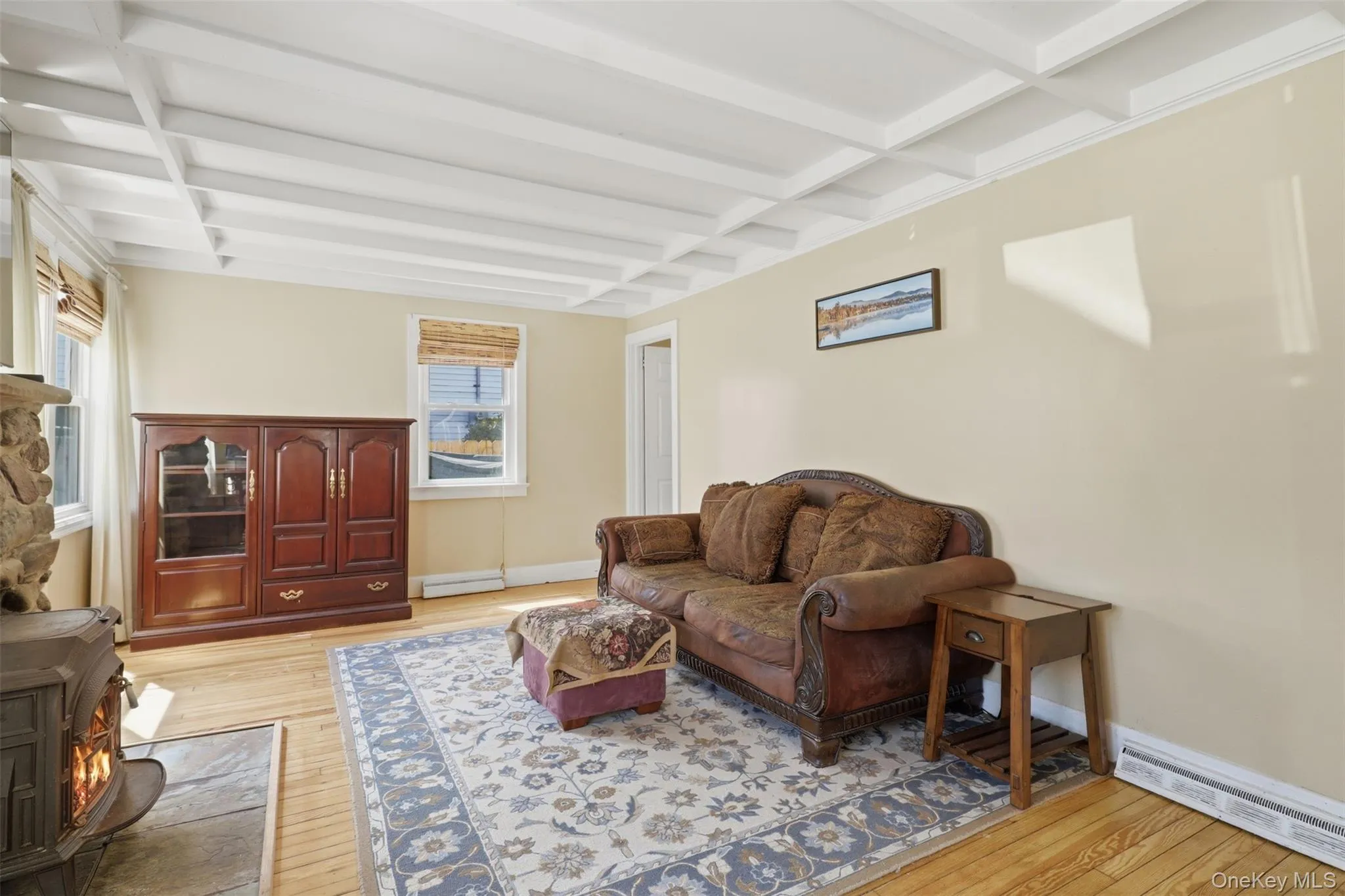 Beautiful detail and charm, hardwood floors, wood burning stove, ceiling detail, and lots of natural light with big windows Beautiful detail and charm, hardwood floors, wood burning stove, ceiling detail, and lots of natural light with big windows