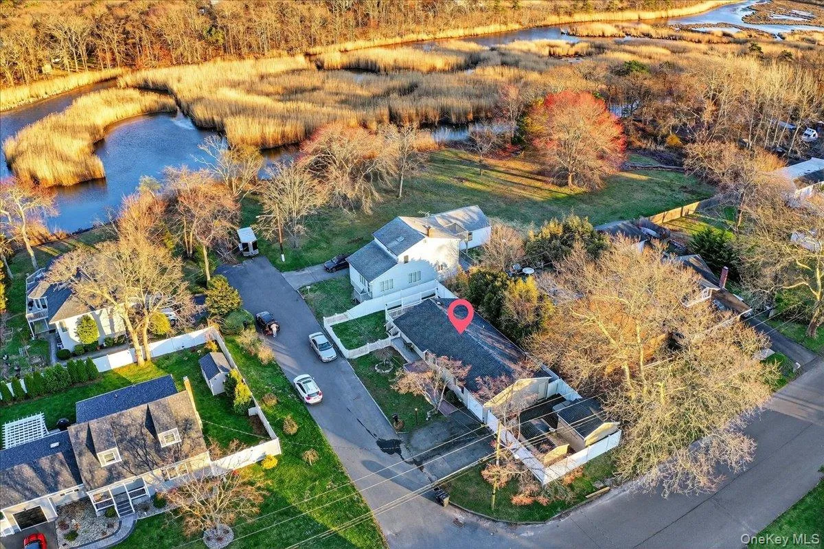 Aerial view of residential area with a large body of water Aerial view of residential area with a large body of water
