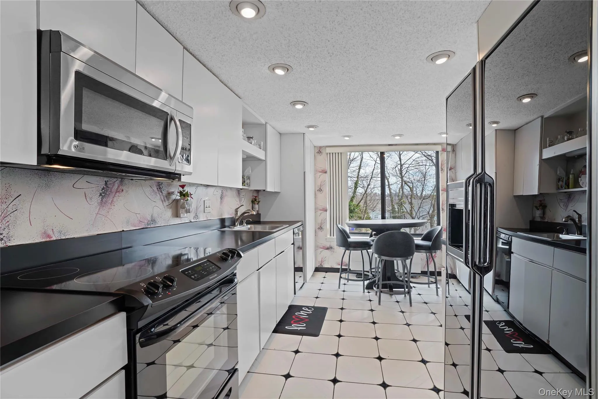 Large kitchen leading to breakfast area. Lots of cabinets plenty of counter space Large kitchen leading to breakfast area. Lots of cabinets plenty of counter space