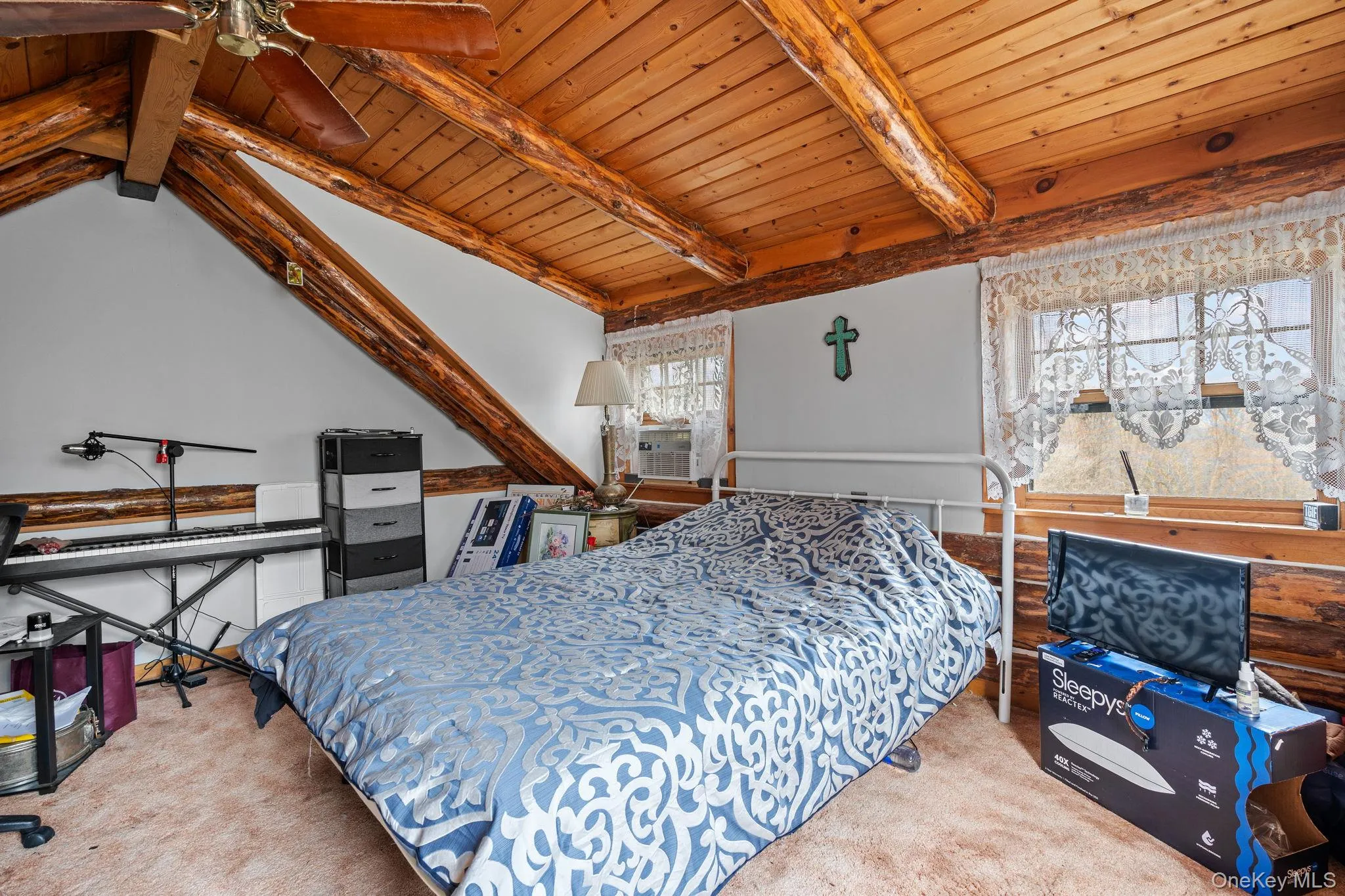 Bedroom with carpet and wooden ceiling Bedroom with carpet and wooden ceiling