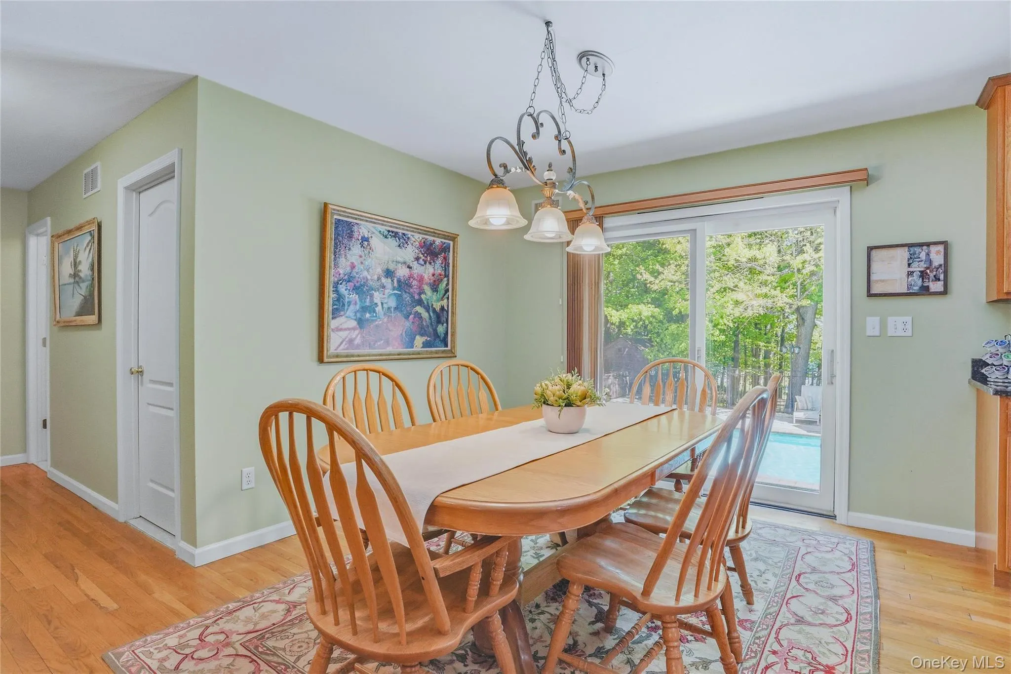 Eat in kitchen dining area with sliding glass doors leading directly to the pool and outdoor entertaining space. Eat in kitchen dining area with sliding glass doors leading directly to the pool and outdoor entertaining space.