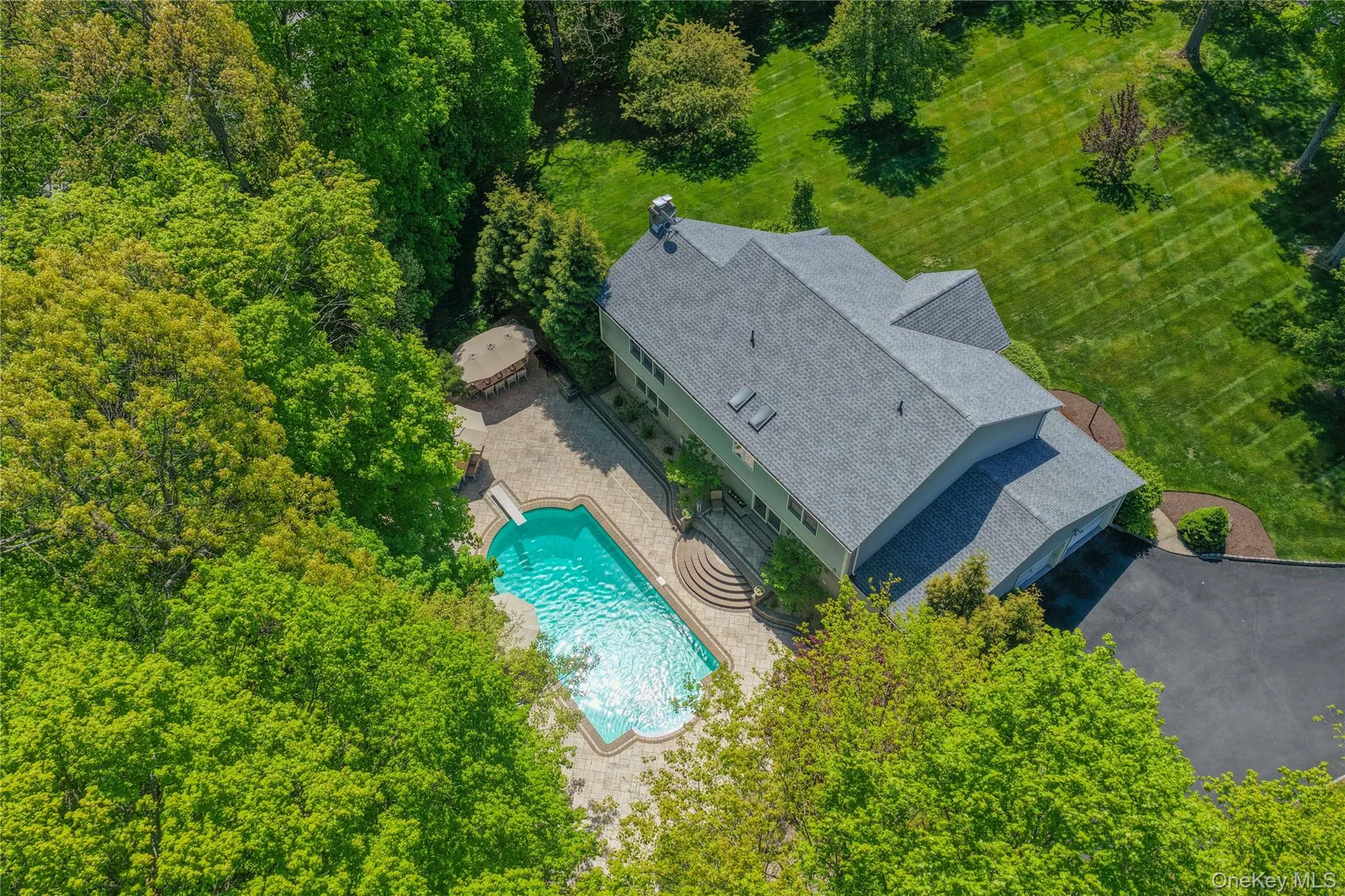 Expansive property featuring a large swimming pool. Expansive property featuring a large swimming pool.