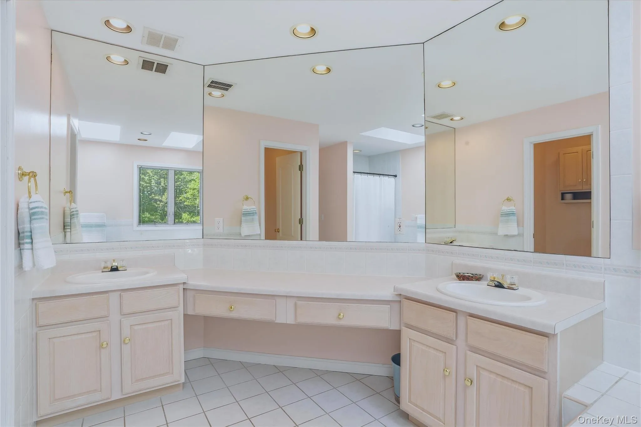 Spa like primary bathroom with double sinks. Spa like primary bathroom with double sinks.